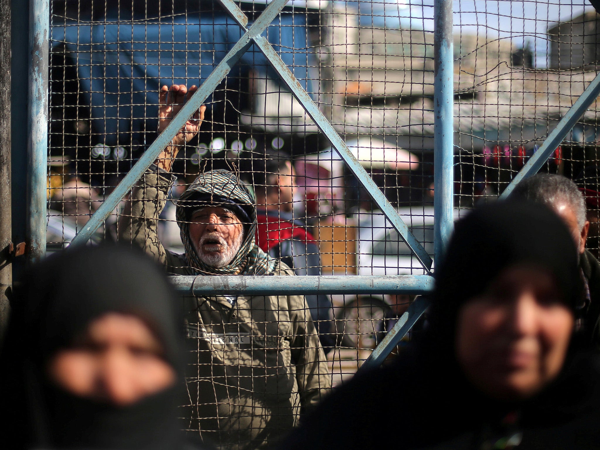 &#13;
Palestinians protest against aid cuts outside the United Nations Relief and Works Agency office in Rafah in the southern Gaza Strip &#13;