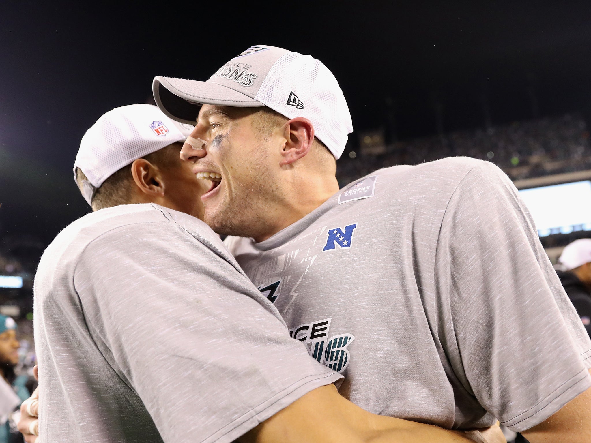 Carson Wentz congratulates fellow quarter-back Nick Foles after the victory