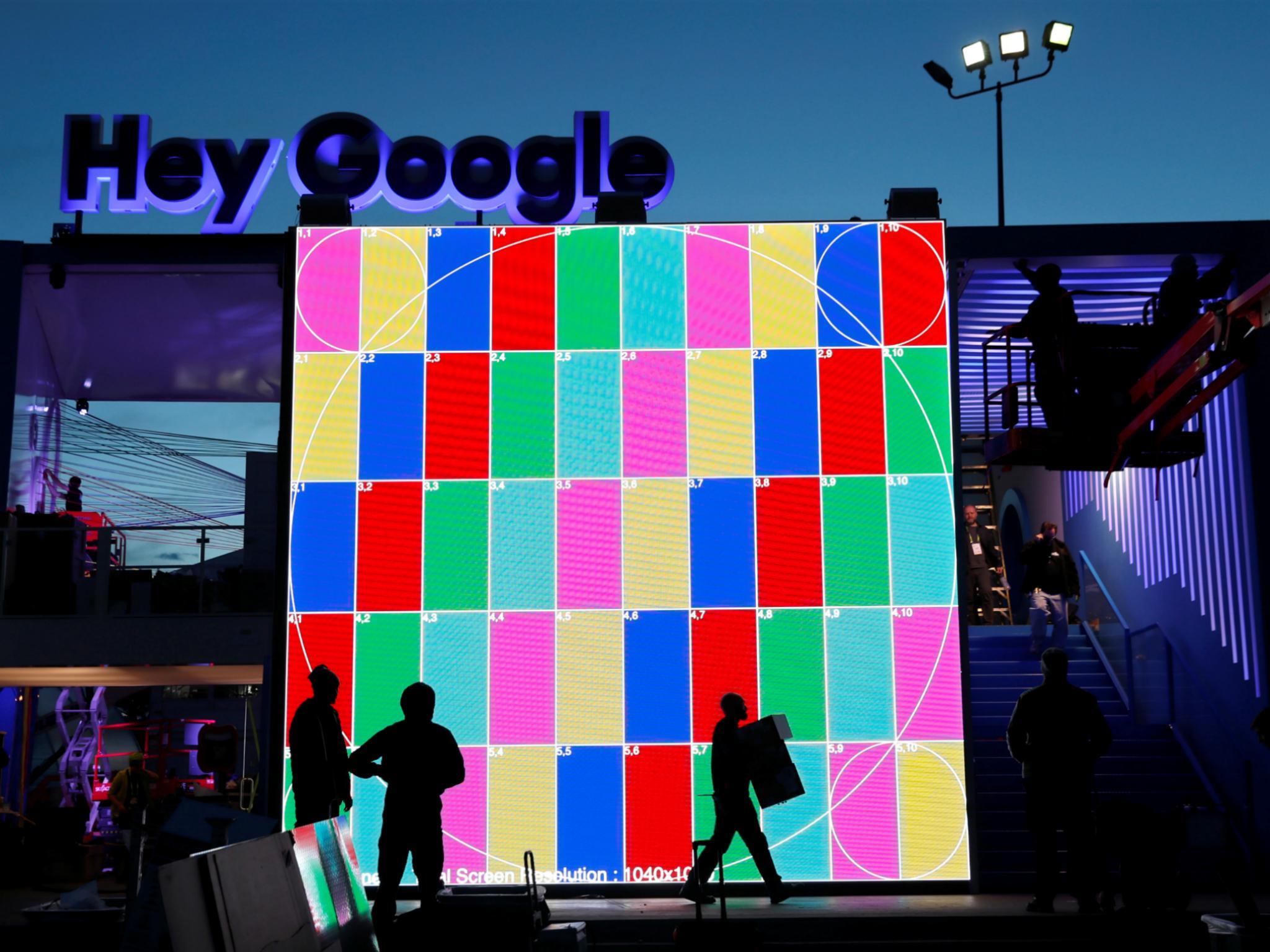 Technicians work on a Hey Google booth in front of the Las Vegas Convention Center in preparation for the 2018 CES in Las Vegas, Nevada, U.S. January 6, 2018