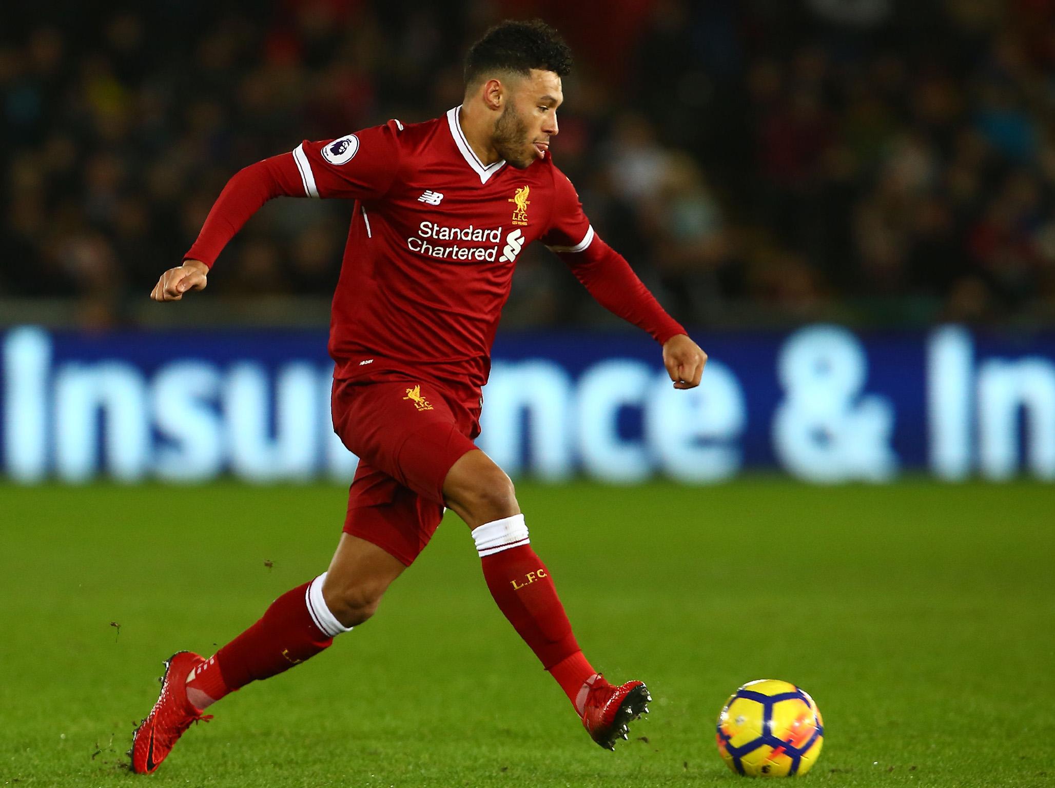 Alex Oxlade-Chamberlain gets his foot on the ball