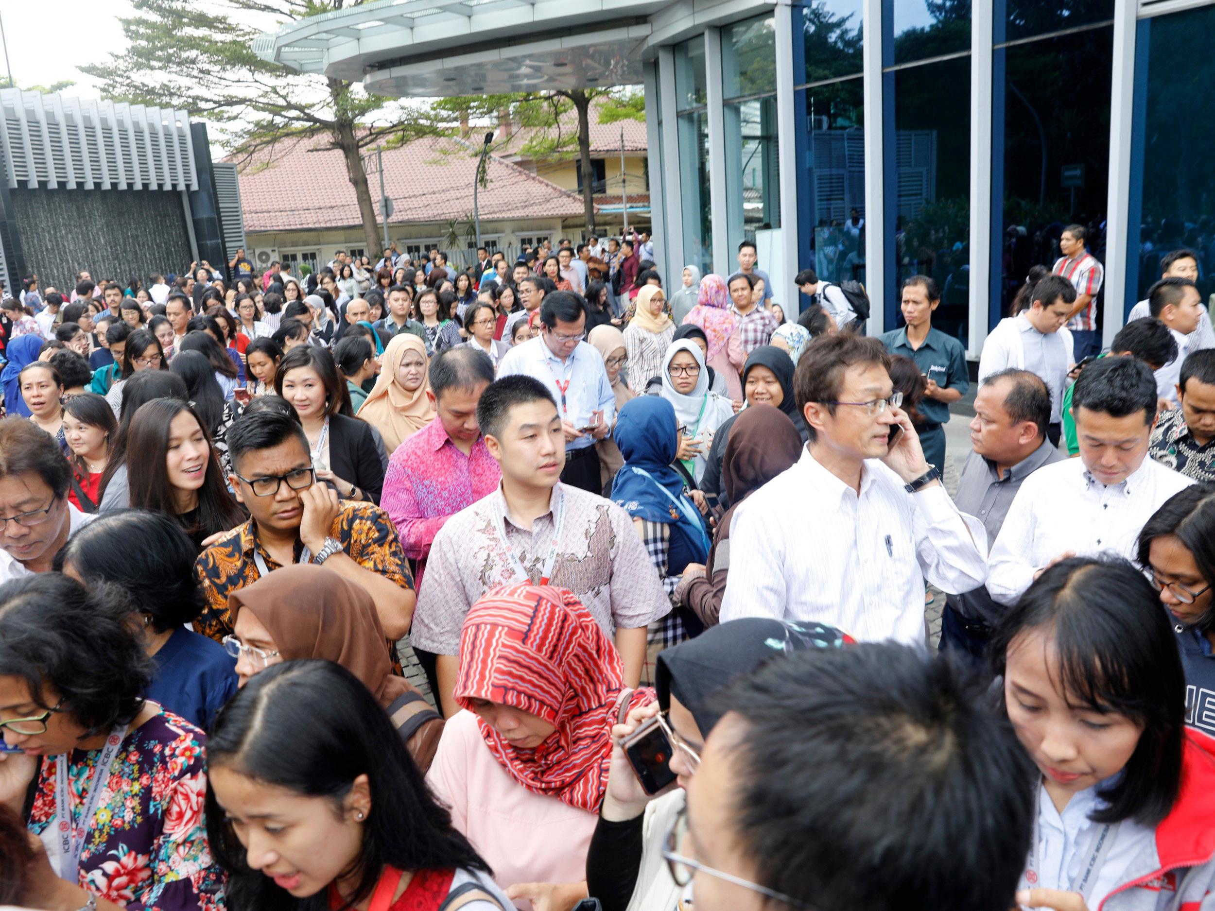 Anxious office workers as building evacuated following the earthquake in Jakarta