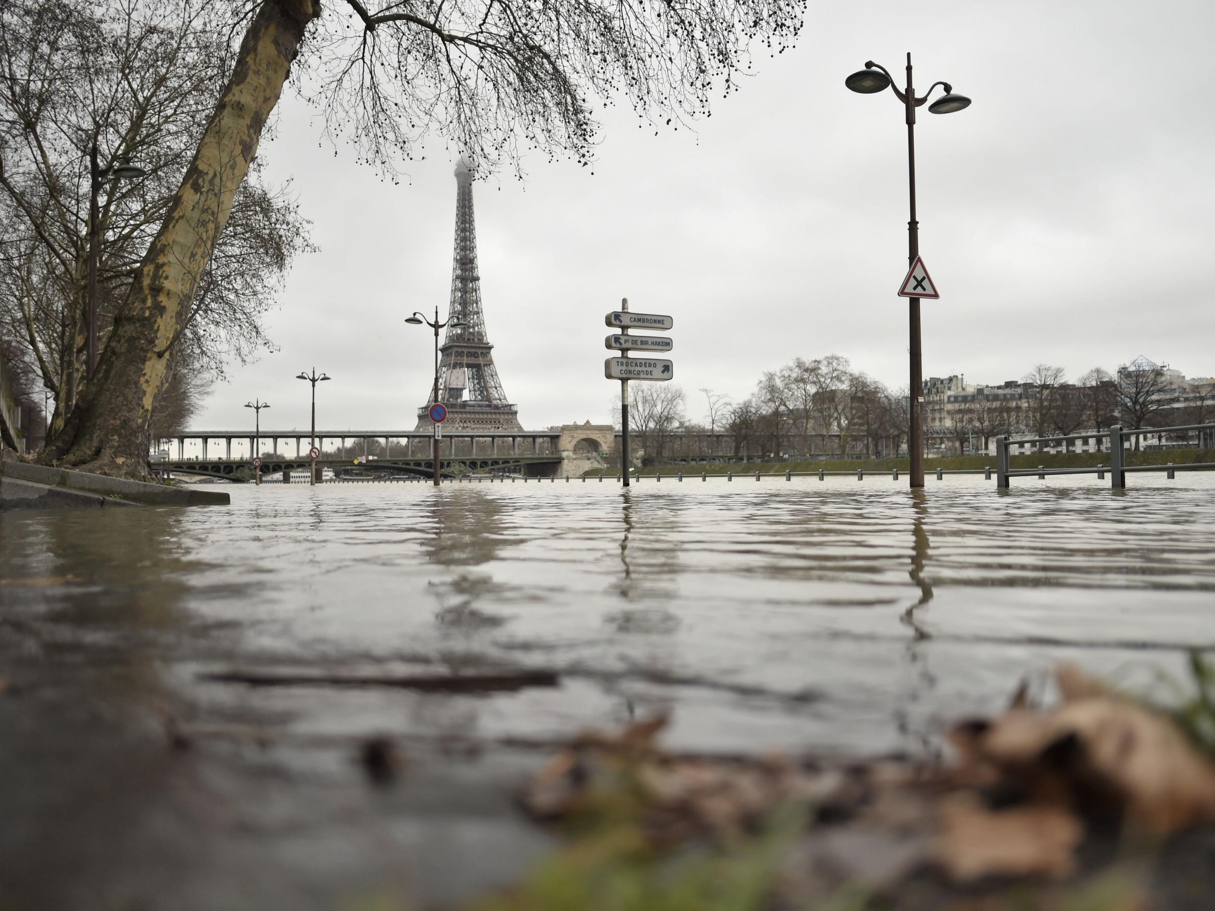 A photo taken on 23 January shows flooded banks of the river Seine, which has overflown after torrential rain has battered Paris