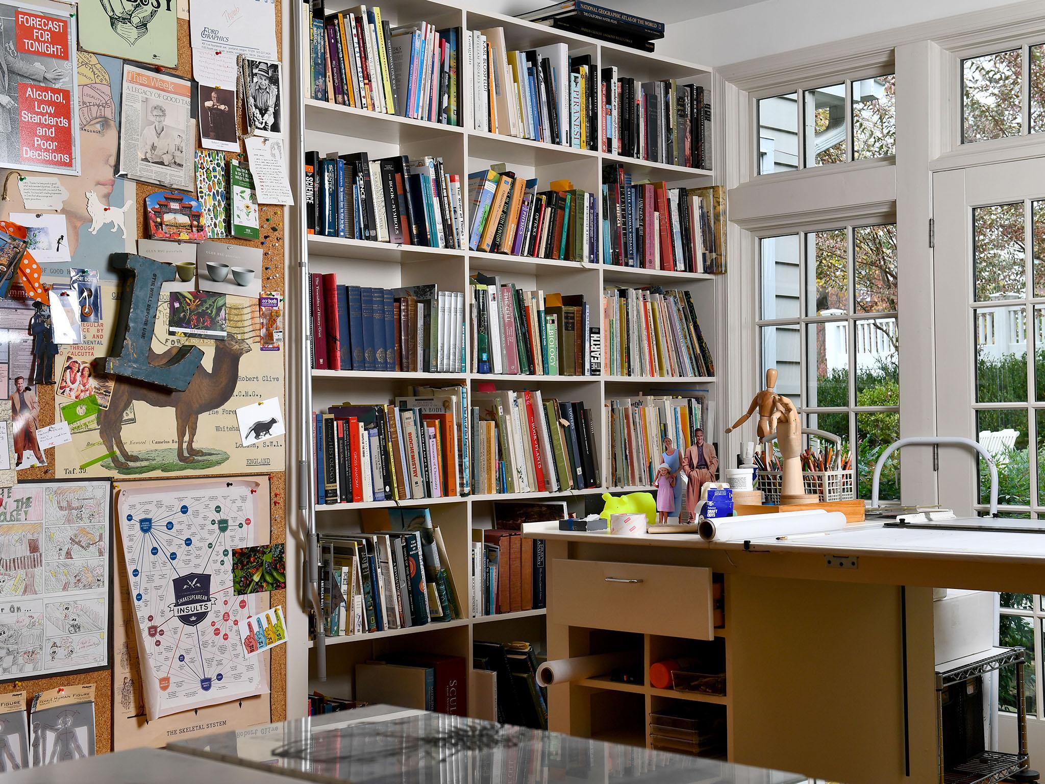 &#13;
Built-in bookcases help define some of the space in Kirkland’s home office/studio&#13;