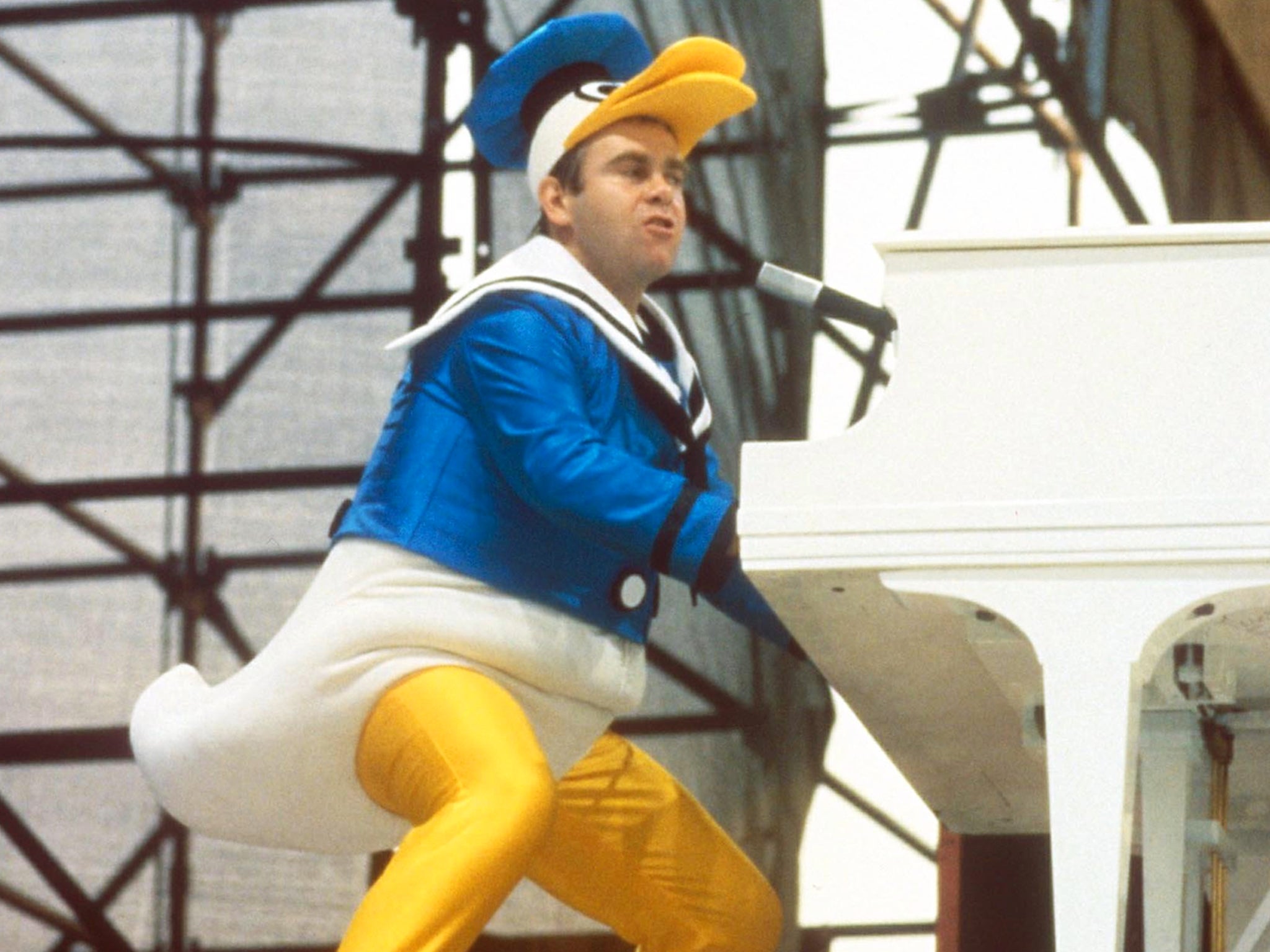 Elton John dressed as Donald Duck to perform in New York City’s Central Park in September 1980 (Rex)