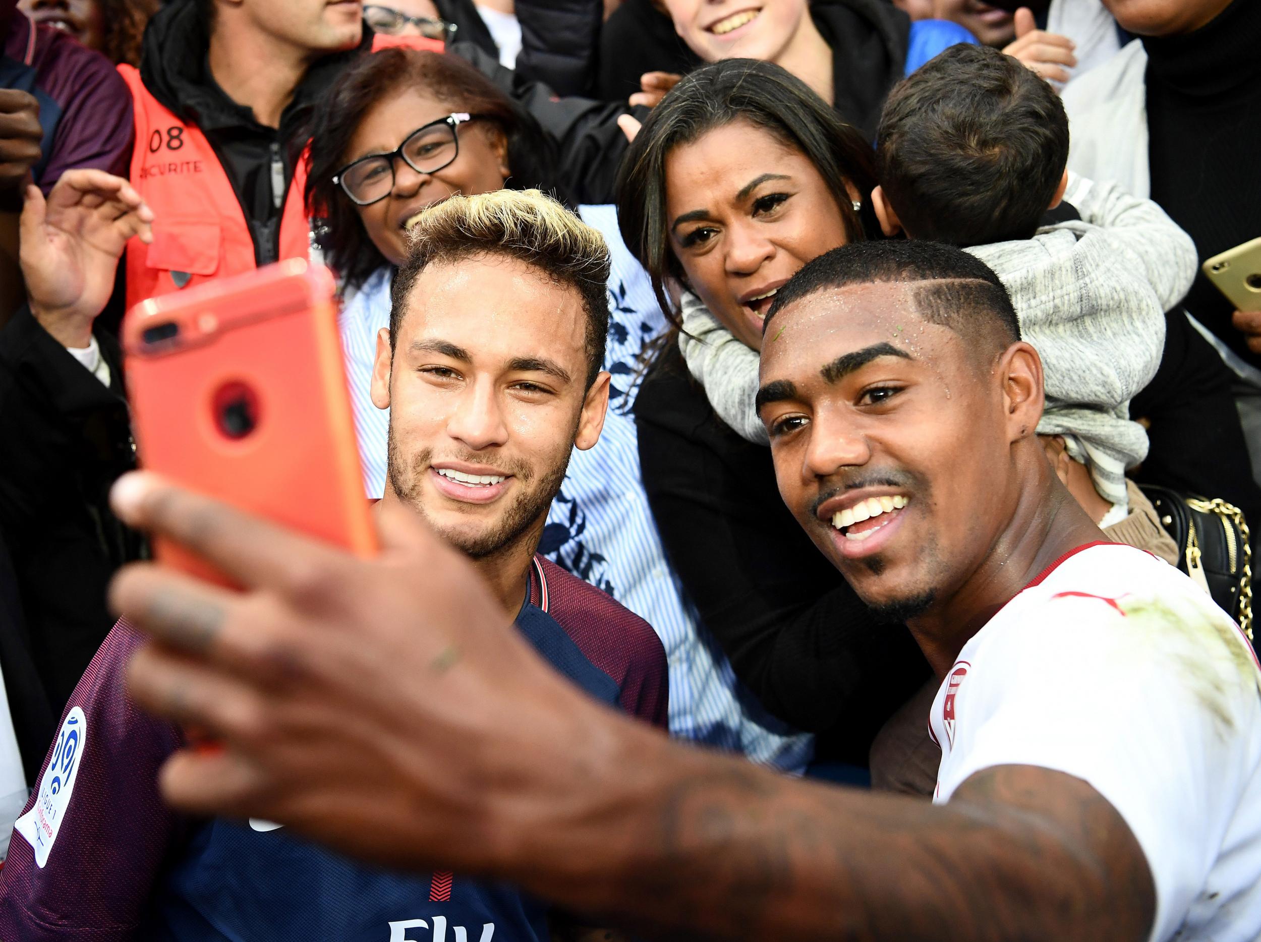 &#13;
Malcom posed with Neymar in September much to his manager's chagrin &#13;