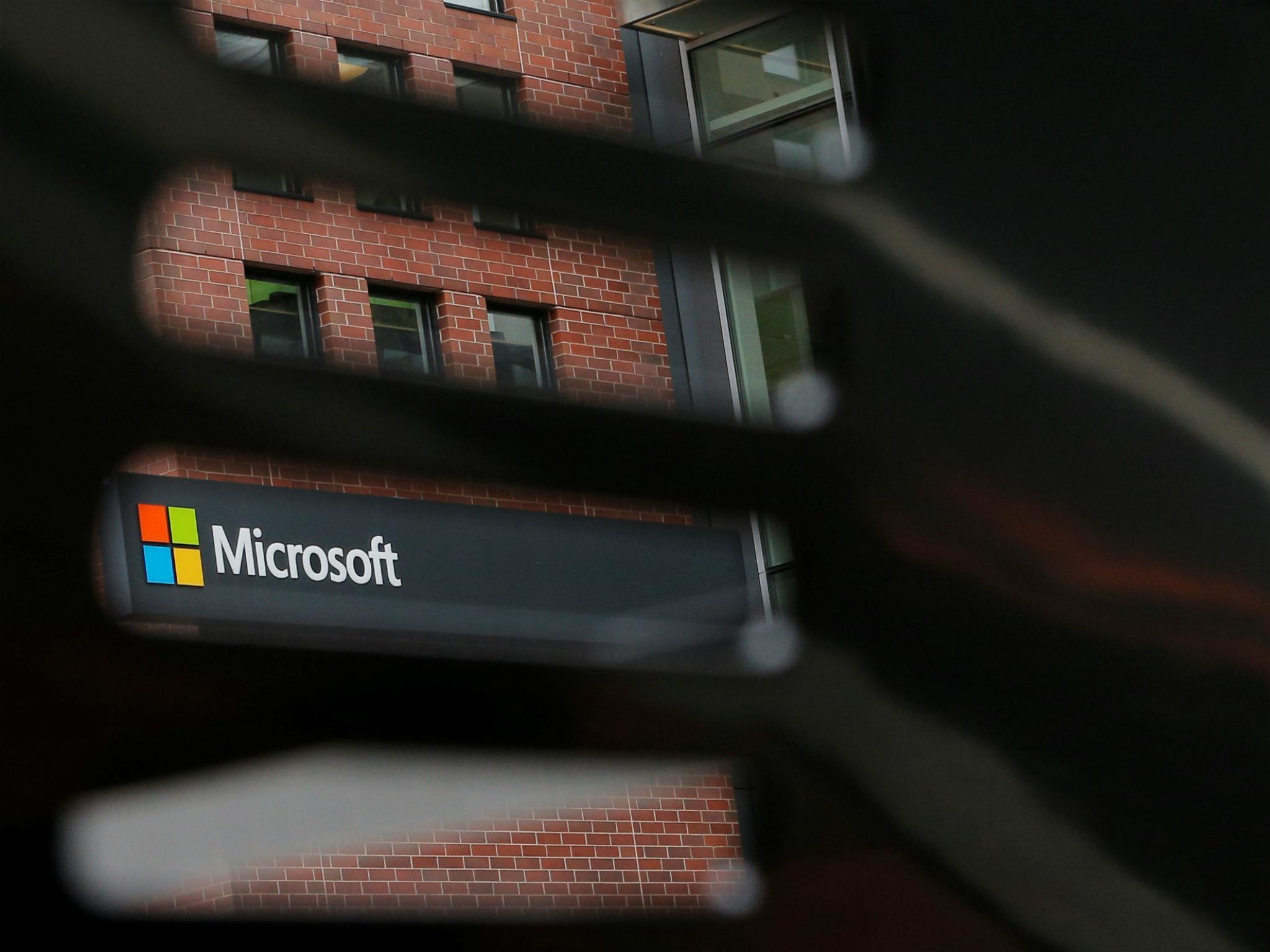 A bench frames a sign outside the Microsoft office in Cambridge, Massachusetts, U.S. May 15, 2017