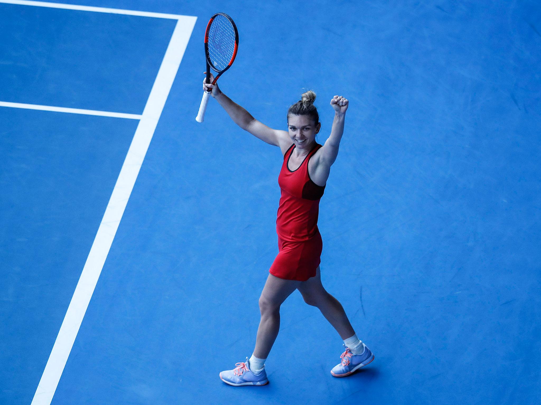 Simona Halep celebrates after her victory over title favourite Angelique Kerber