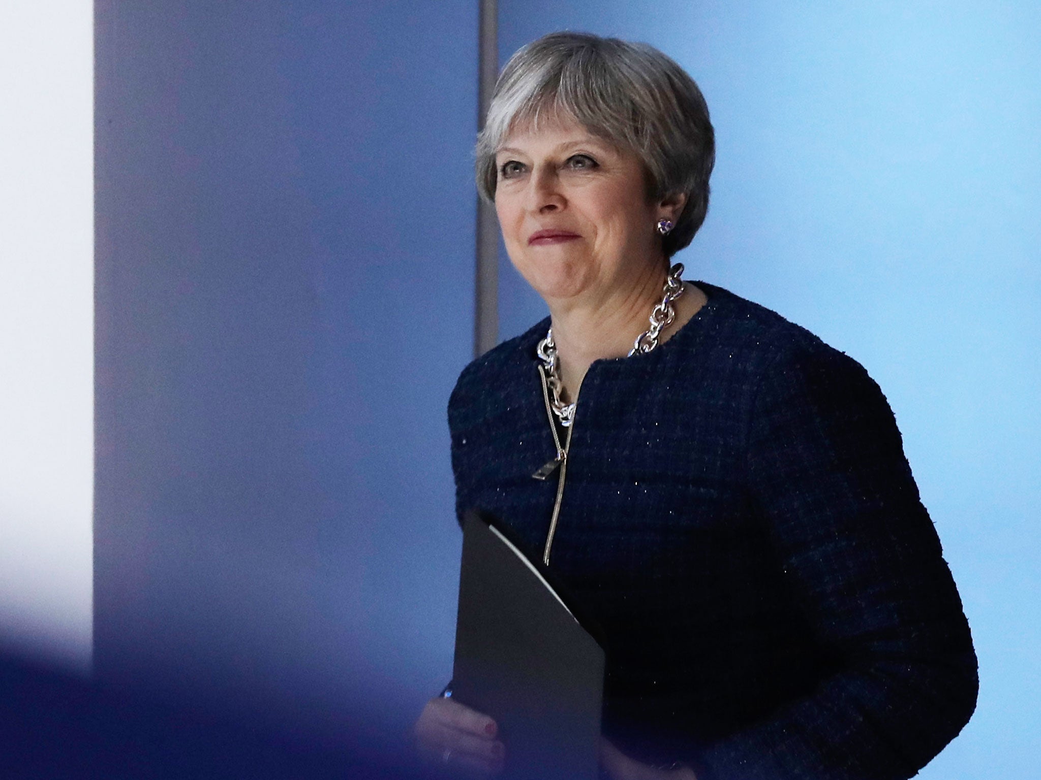 Theresa May arriving for her speech in Davos - before the latest outbreak of Tory Brexit infighting