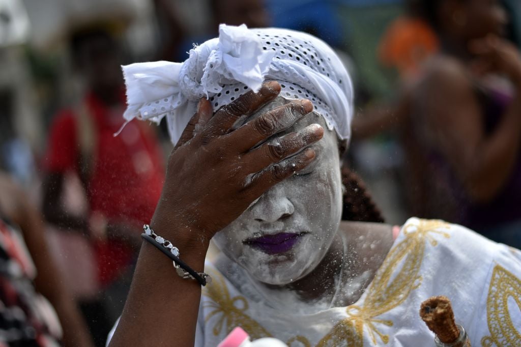 A devotee in the role of the loa Gede during ceremonies honouring the Haitian vodou spirit of Baron Samedi (AFP/Getty)