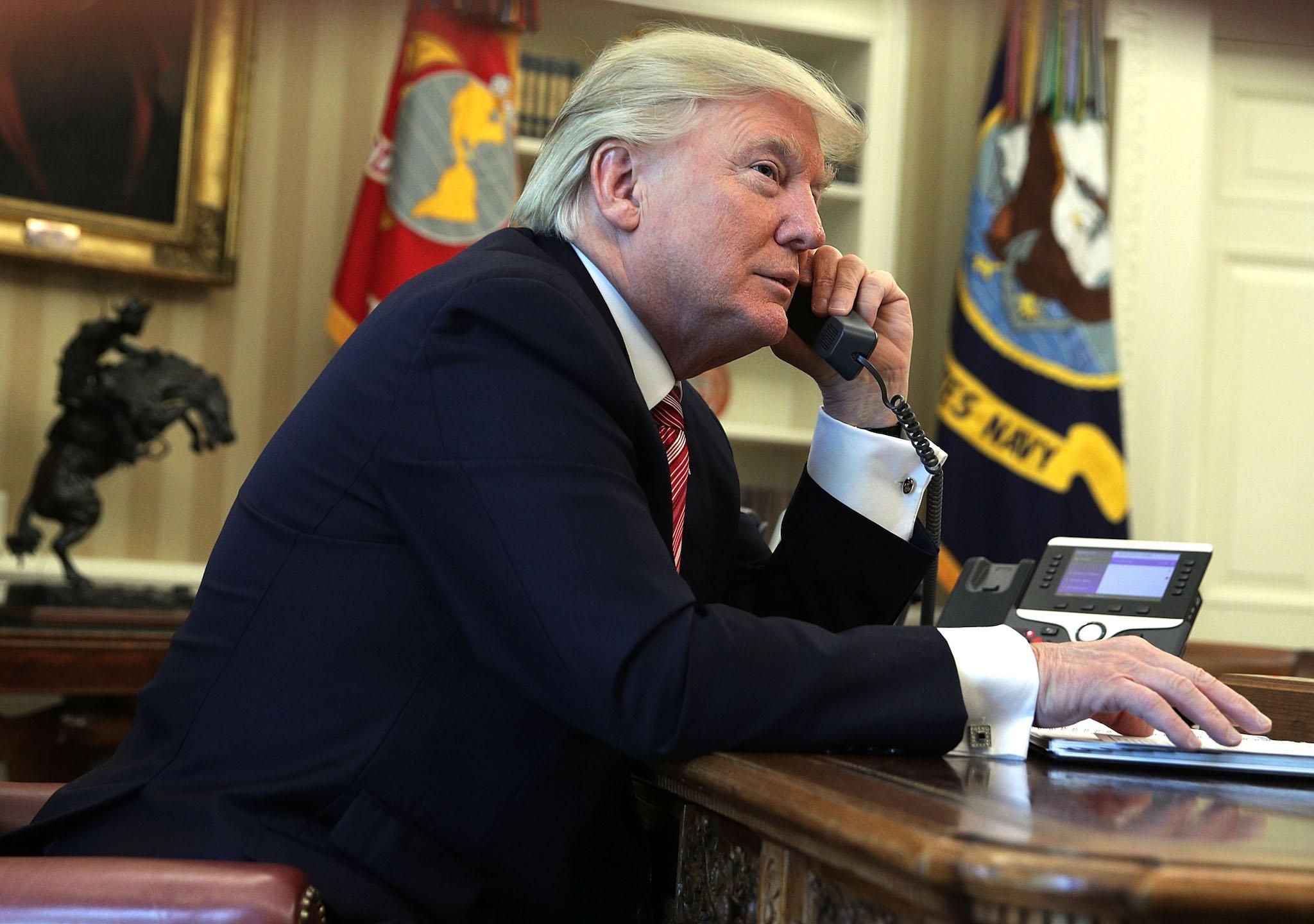 U.S. President Donald Trump speaks on the phone with Irish Prime Minister Leo Varadkar on the phone in the Oval Office of the White House June 27, 2017 in Washington, DC