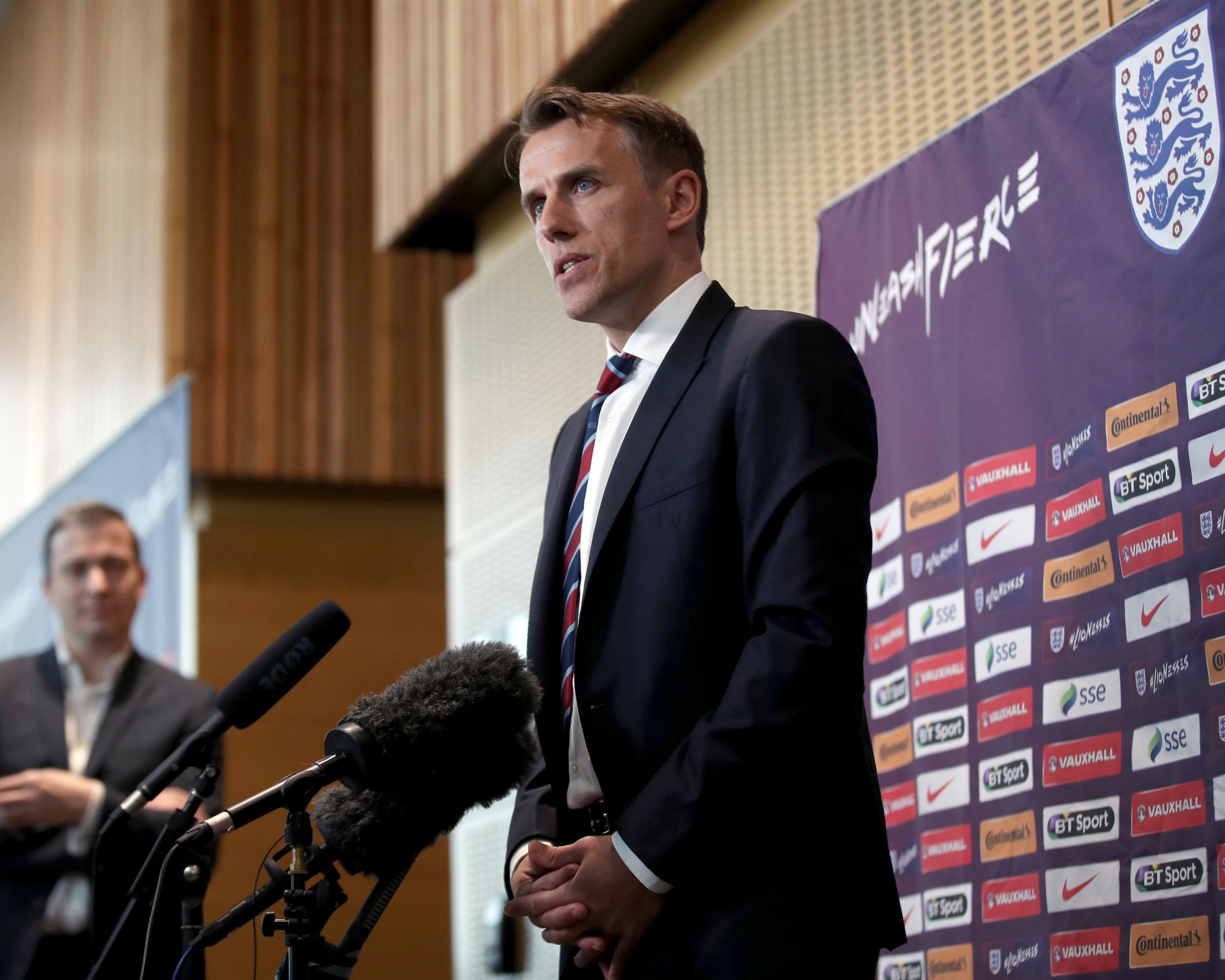 Neville speaking to the press on his appointment