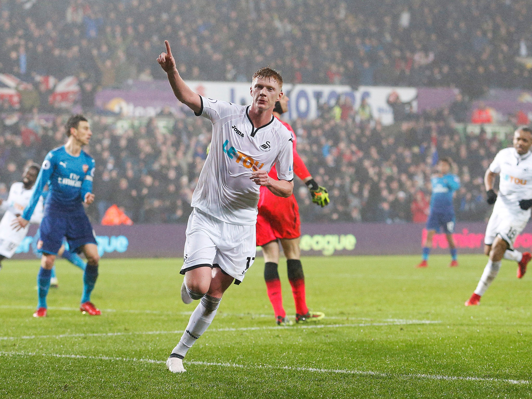 Sam Clucas celebrates after equalising for Swansea following Nacho Monreal's opener