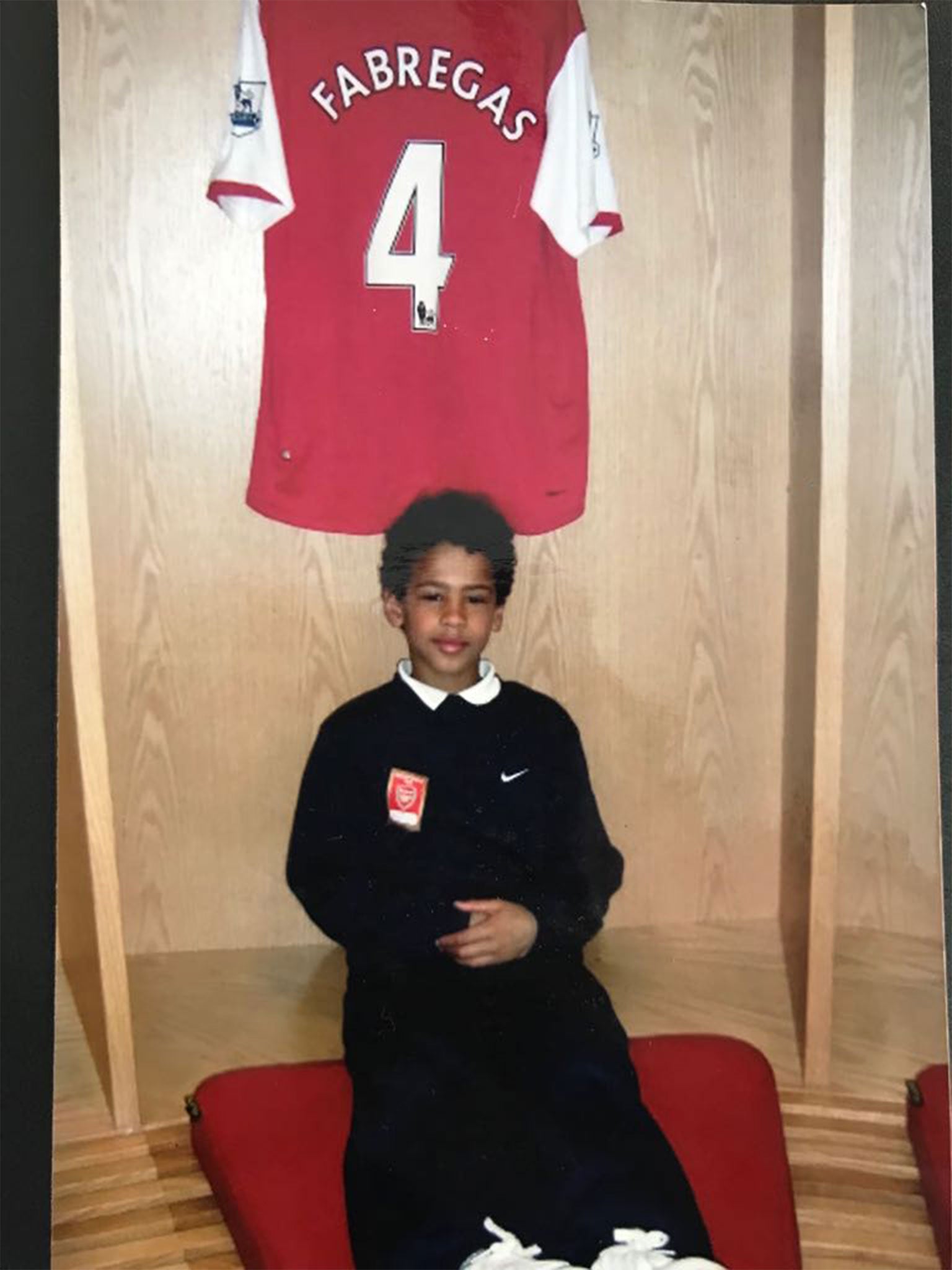 McGuane poses with a Fabregas shirt as a child