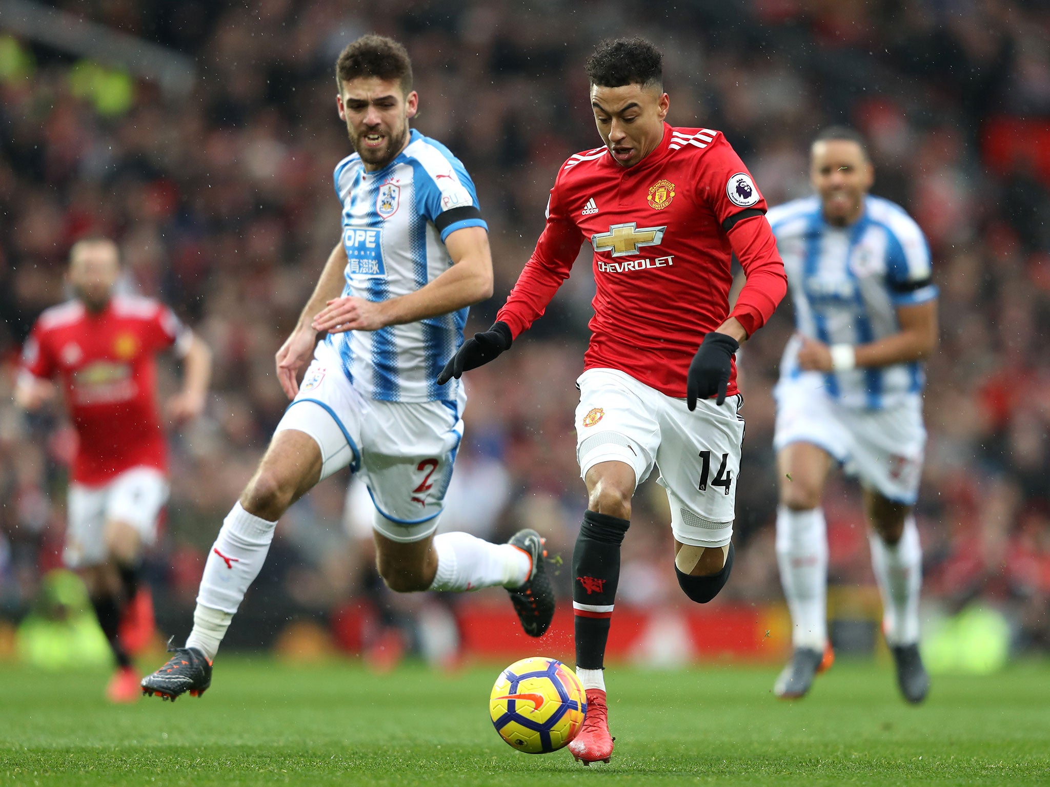 Jesse Lingard attempts to get away from Tommy Smith