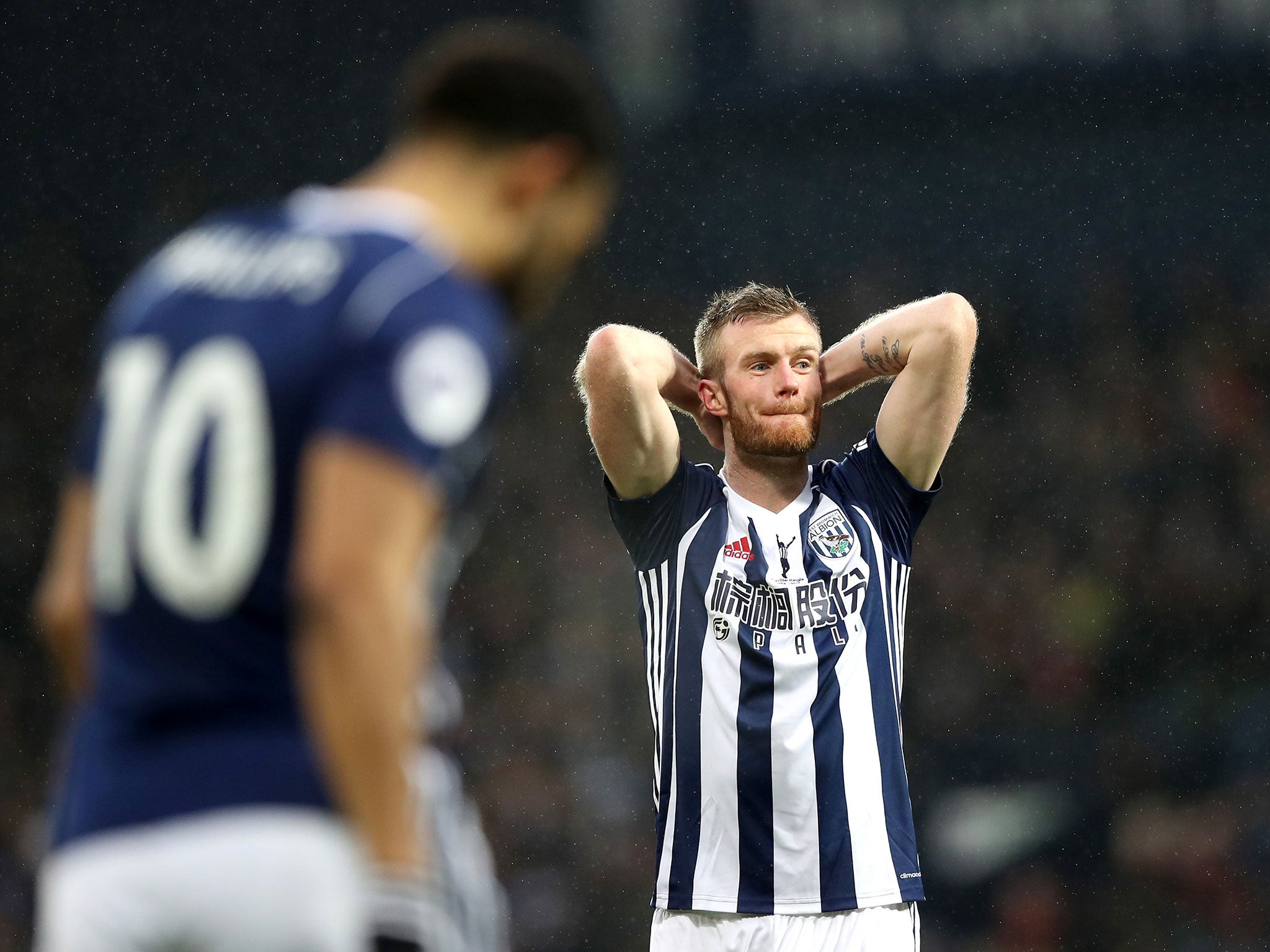 Chris Brunt reacts after the final whistle