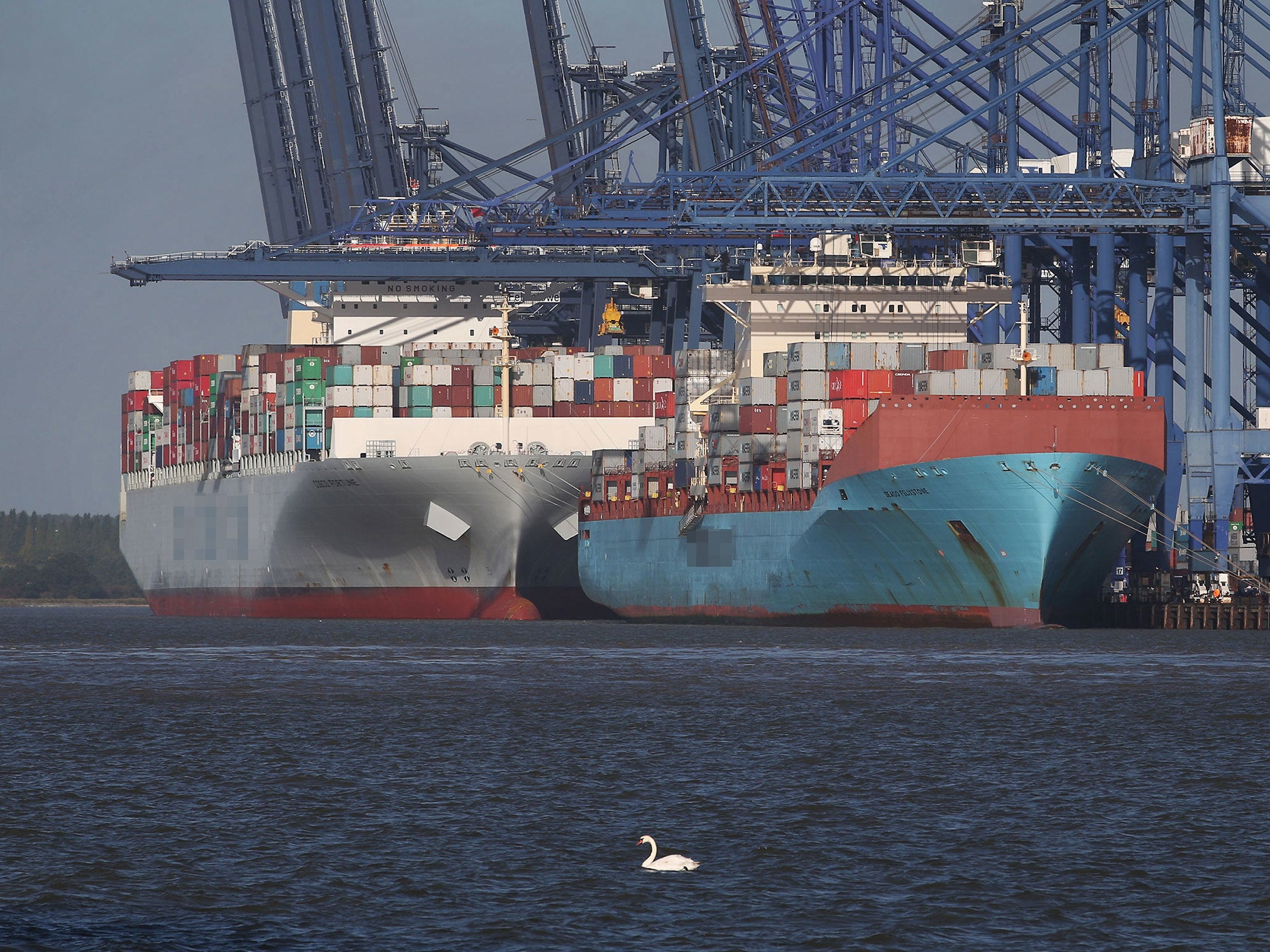 Cargo ships docked at a port in the UK