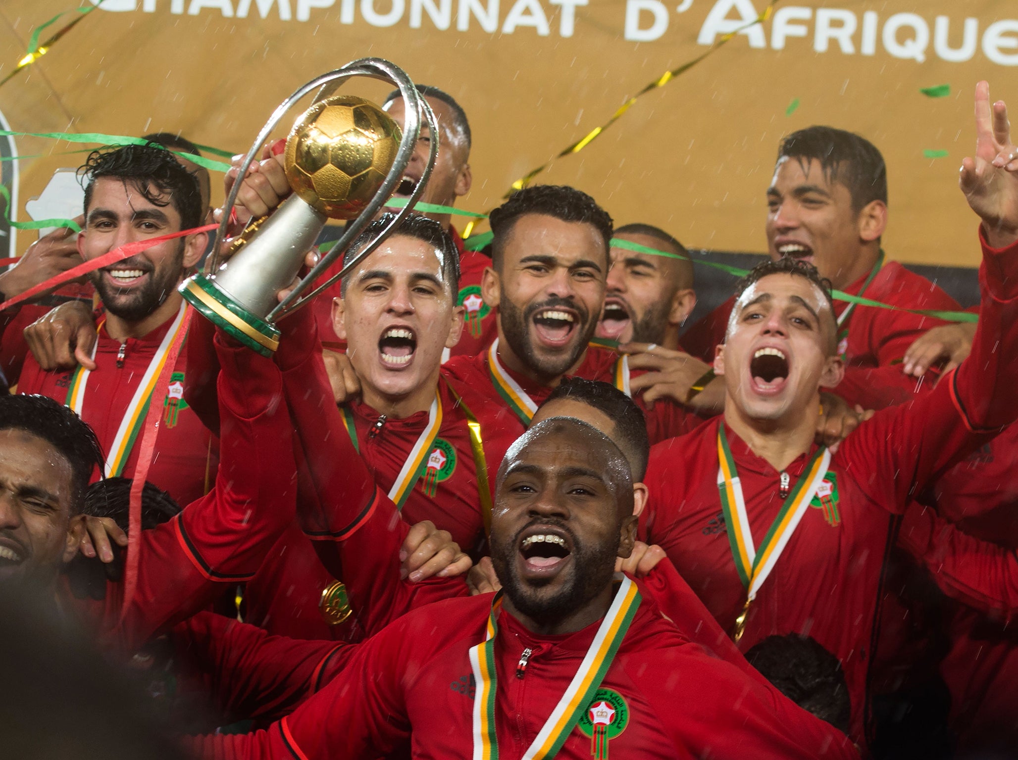 Morocco's Badr Banoun holds up the CHAN trophy