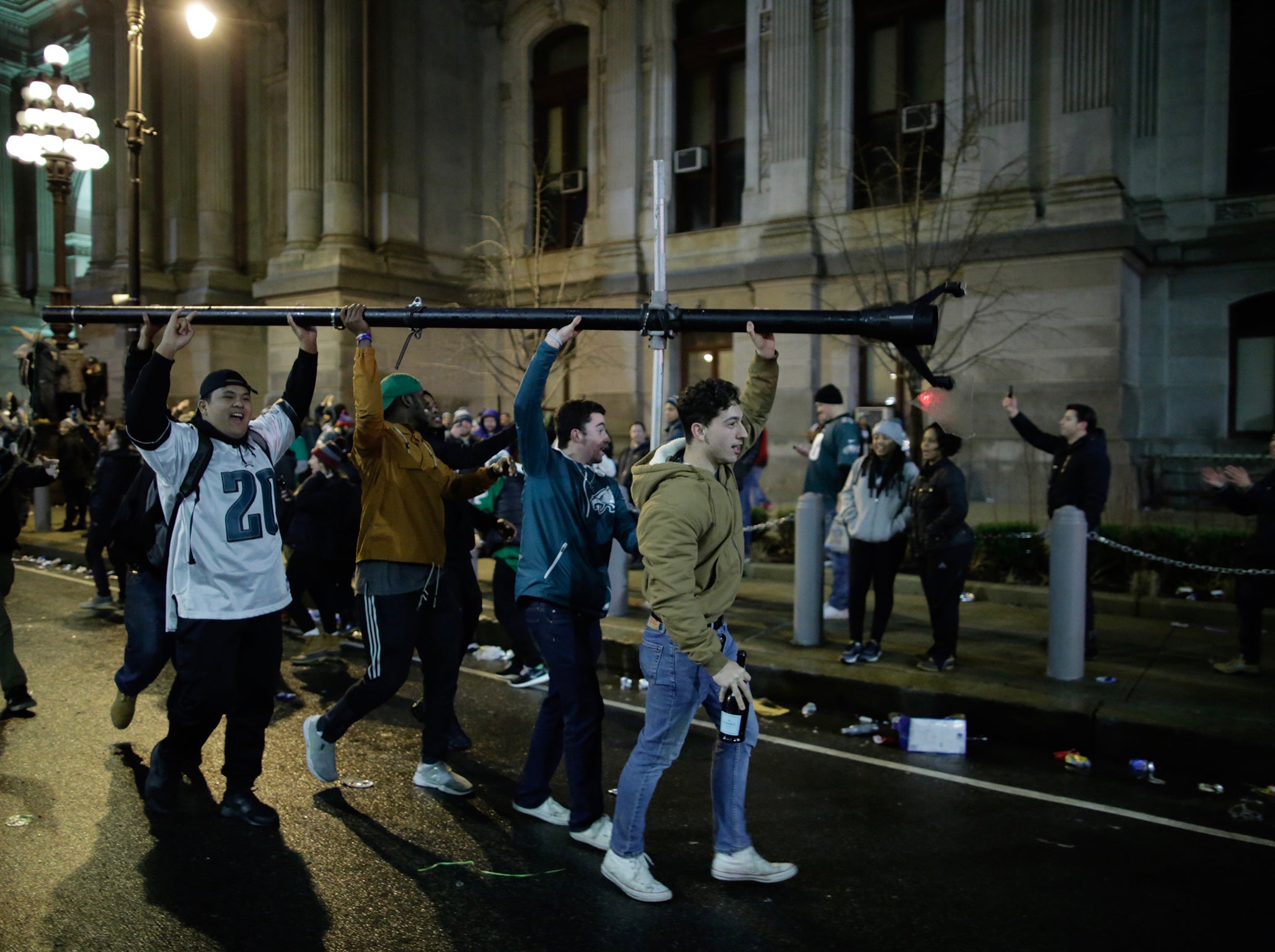 Eagles fans on the march with a lamp post