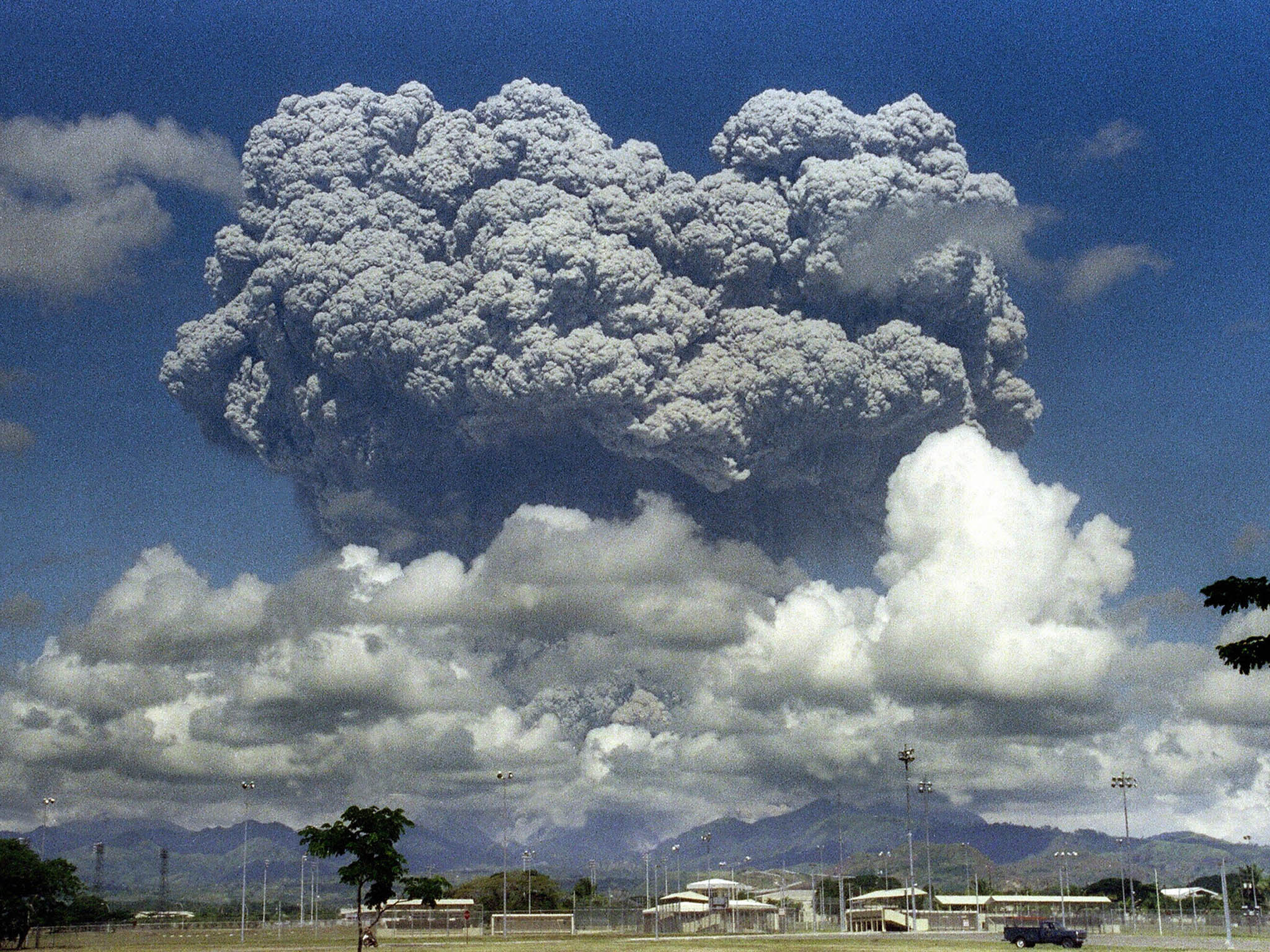 Gases released by powerful explosions can reflect sunlight away from the Earth