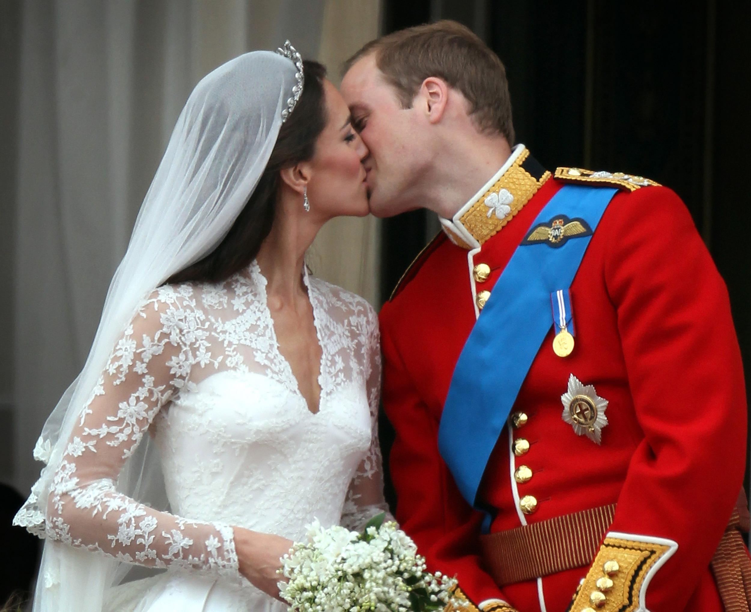 Prince William, Duke of Cambridge and Catherine, Duchess of Cambridge kiss on the balcony at Buckingham Palace on April 29 2011 on the day of their royal wedding.