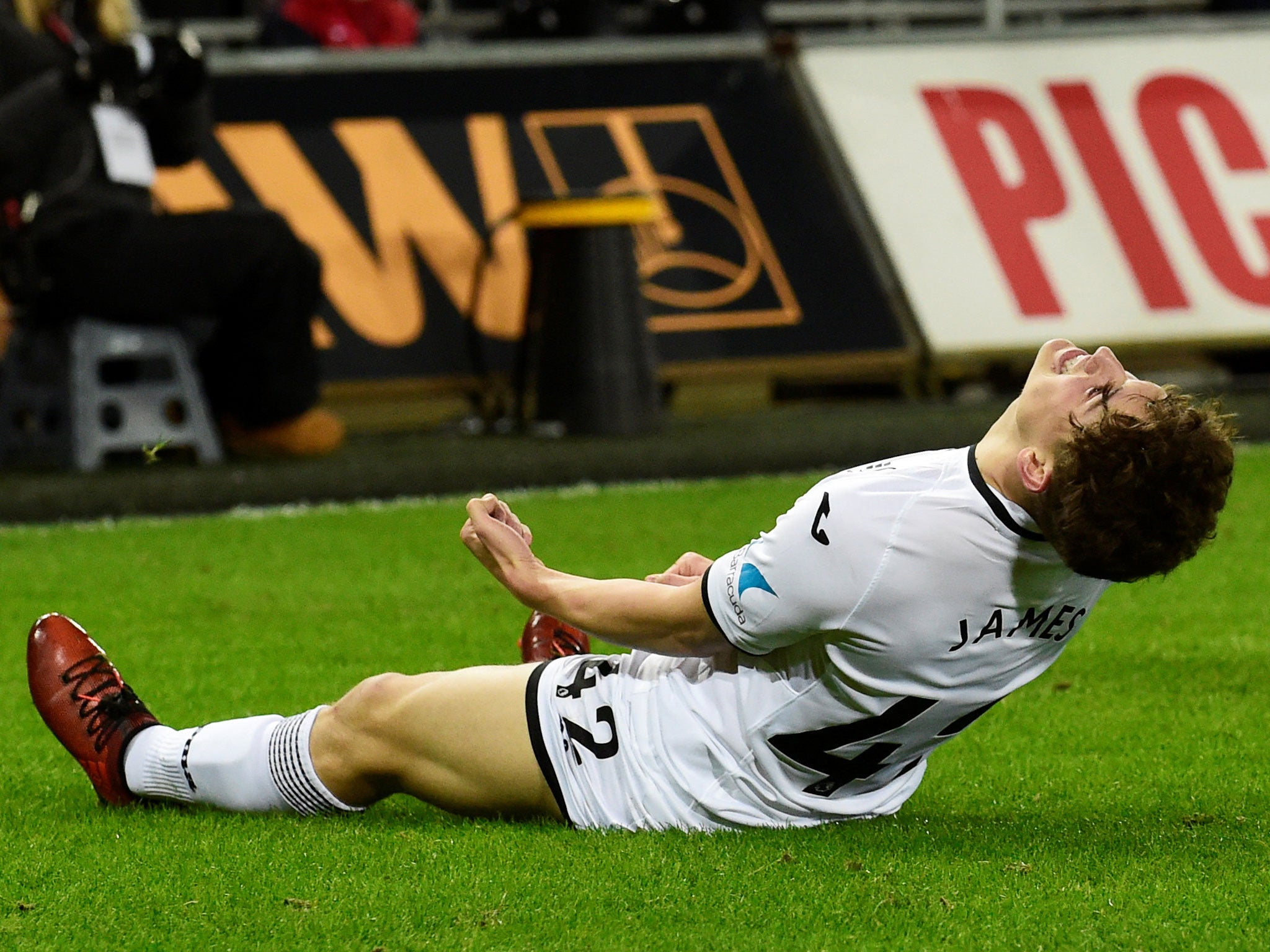 Swansea City's Daniel James celebrates scoring the club's eighth goal against Notts County