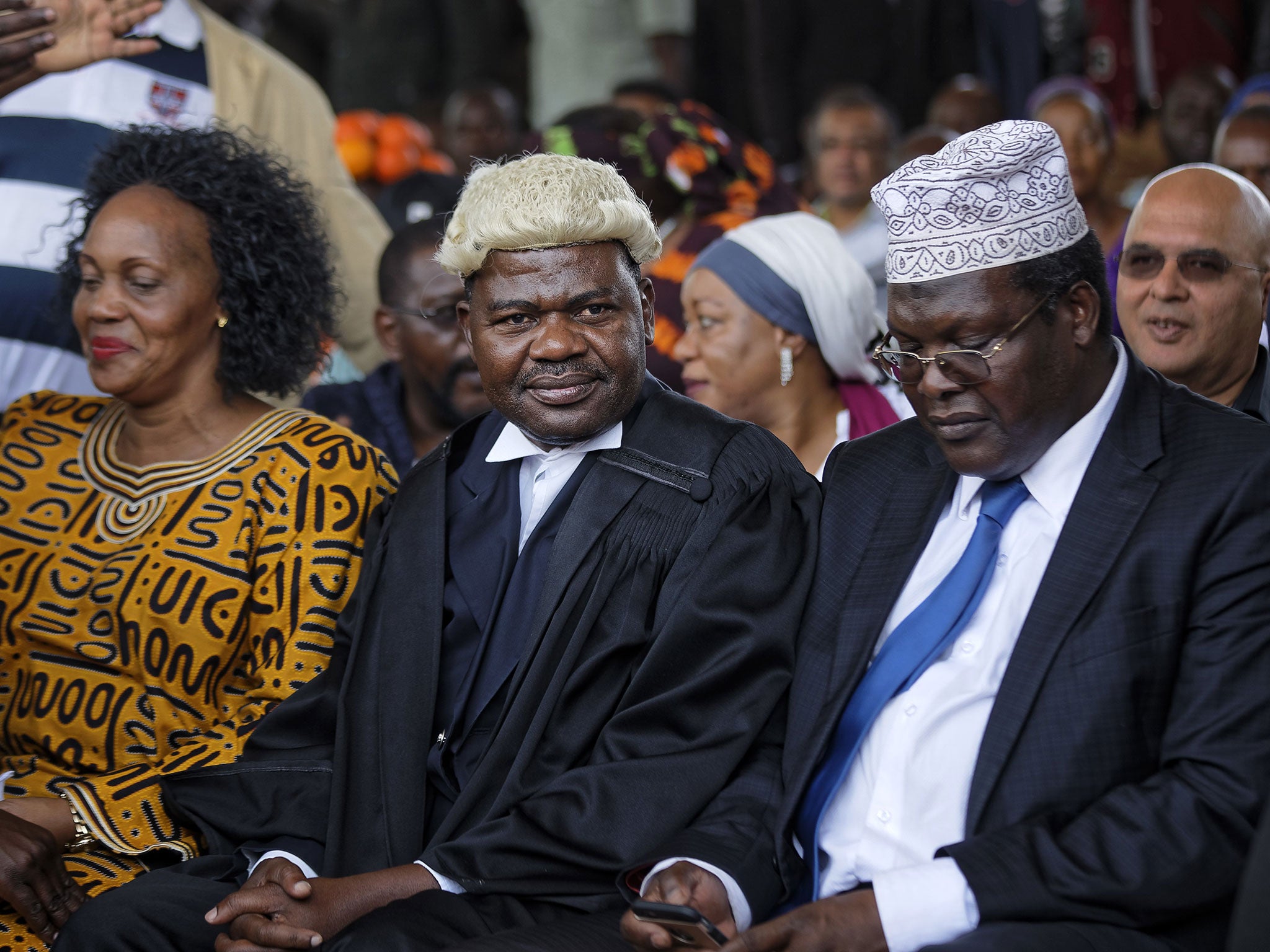 Miguna Miguna, right, attended a mock 'swearing-in' ceremony for opposition leader Raila Odinga at Uhuru Park in Nairobi at the end of January