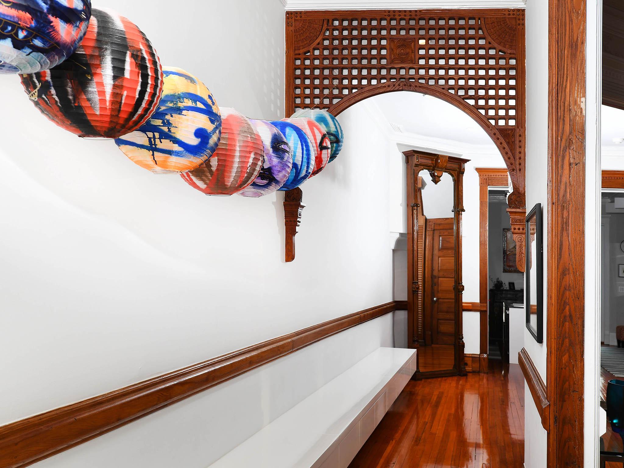 A long built-in bench starts by the front door, extends through the hall and reappears in the kitchen