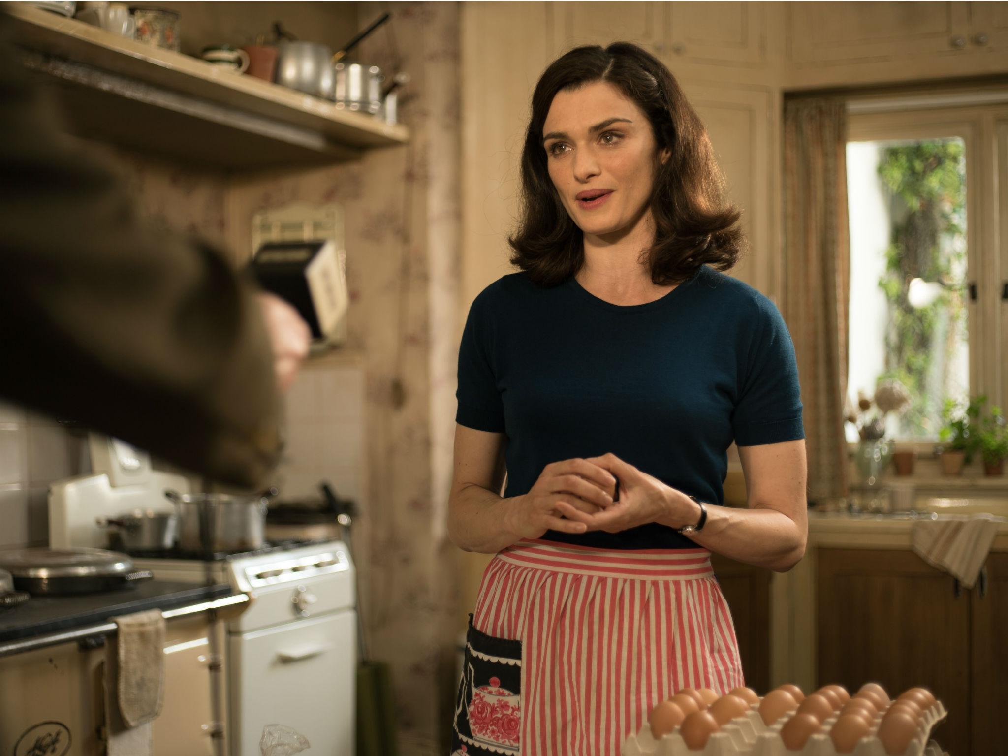 Weisz plays a dutiful housewife supporting her husband in his madcap scheme