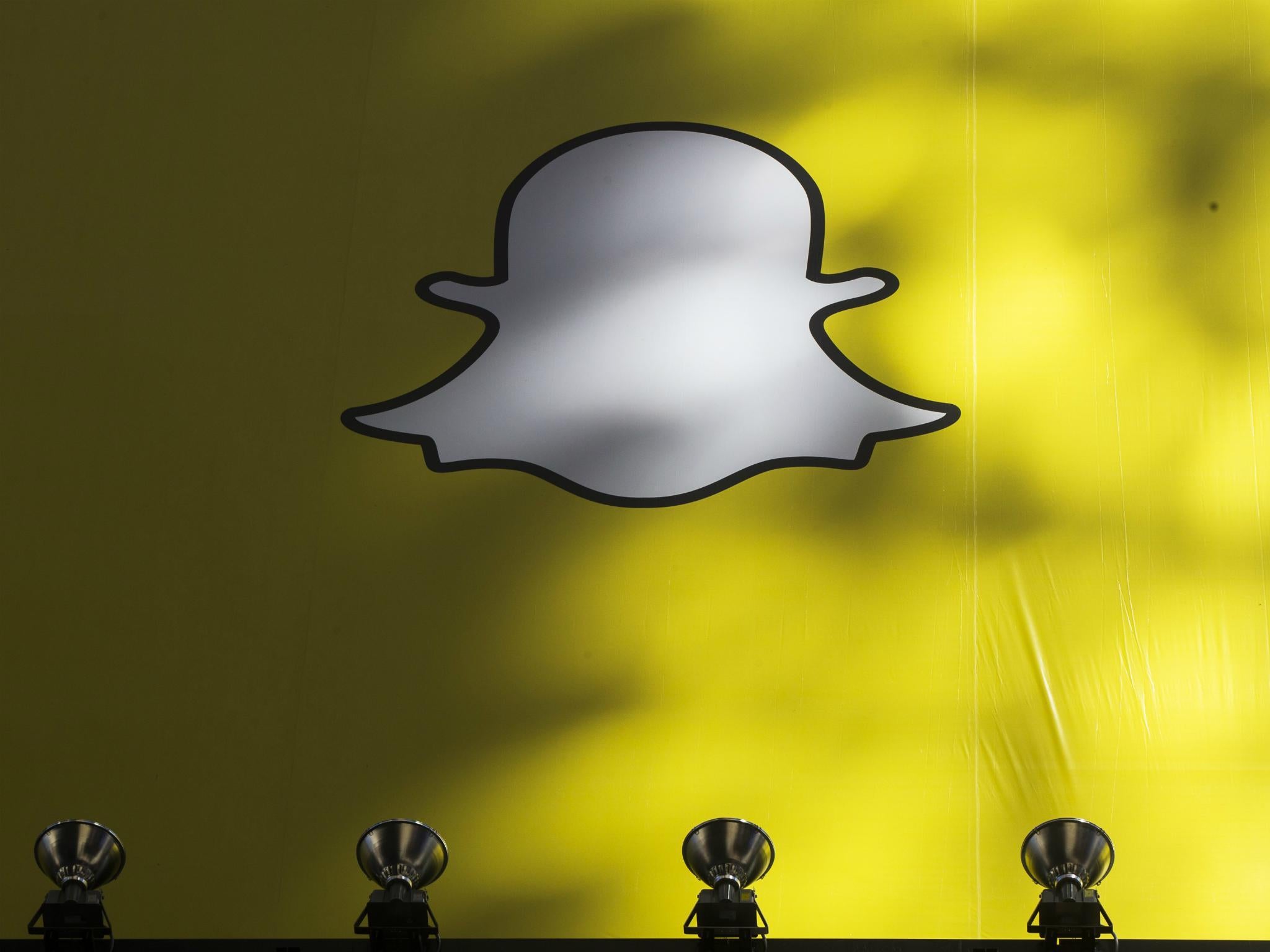 A billboard displays the logo of Snapchat above Times Square in New York March 12, 2015