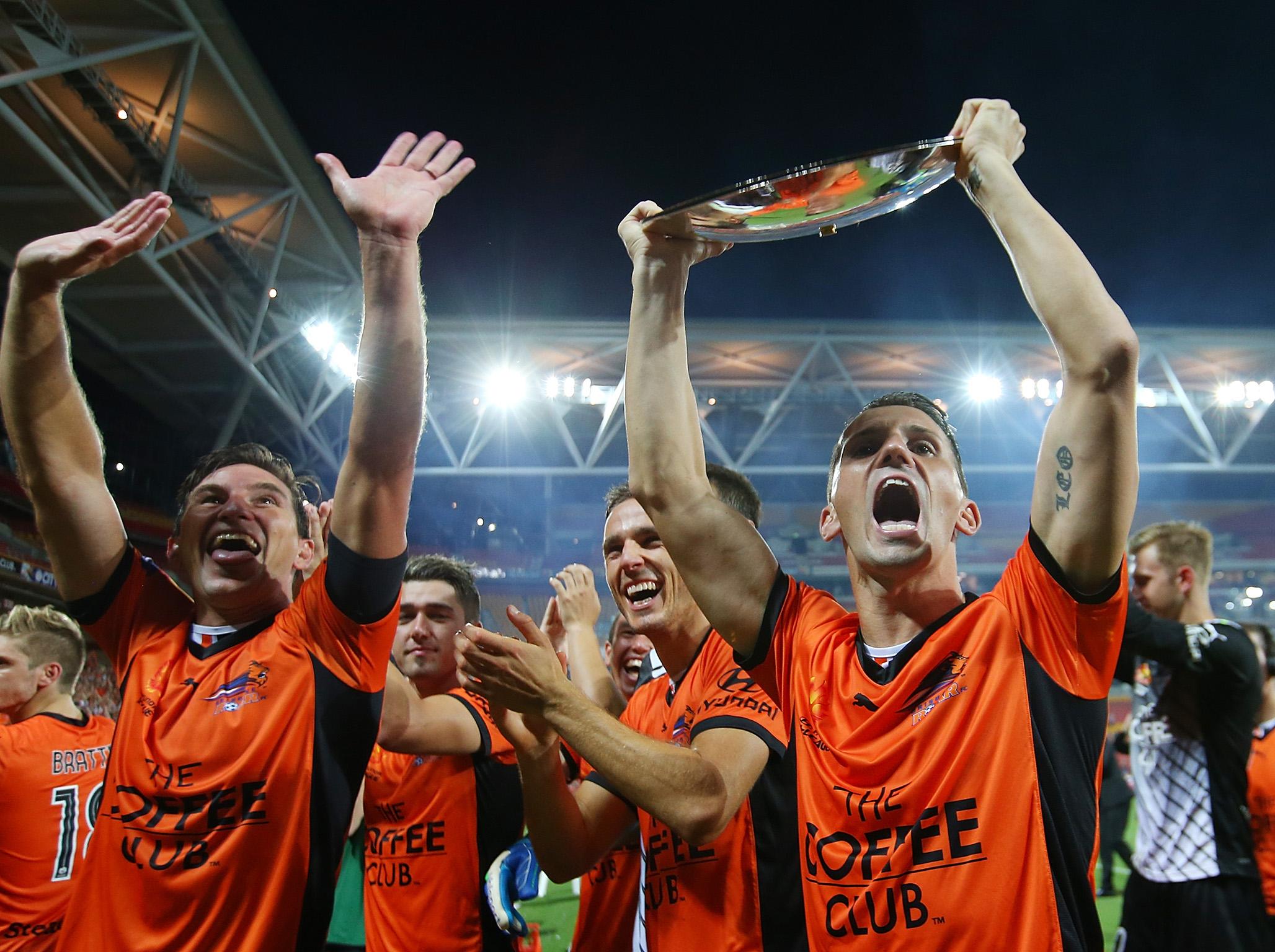 Liam Miller, right, celebrating winning the Premiers Plate with Brisbane Roar