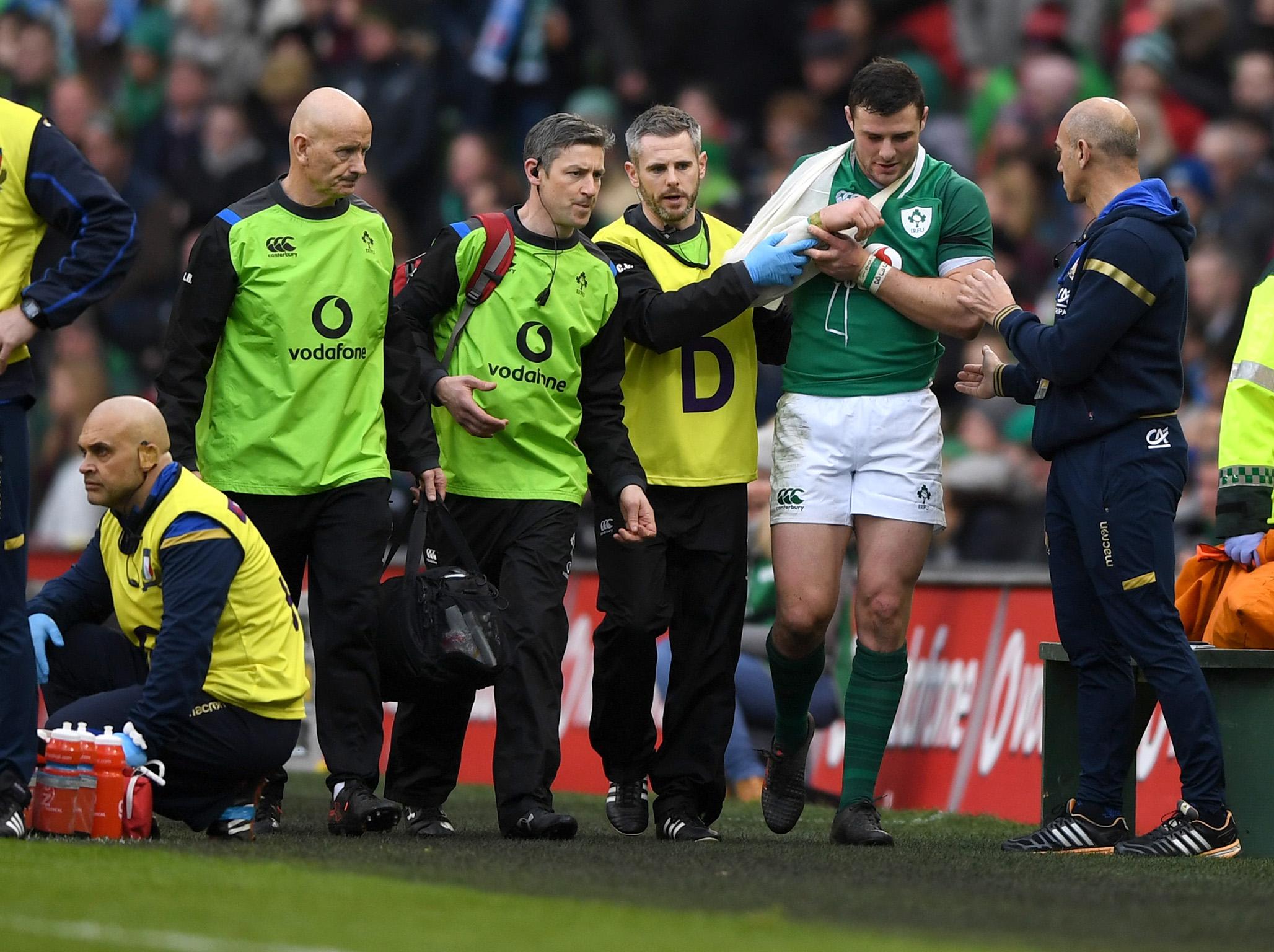 Robbie Henshaw leaves the field injured having scored two tries