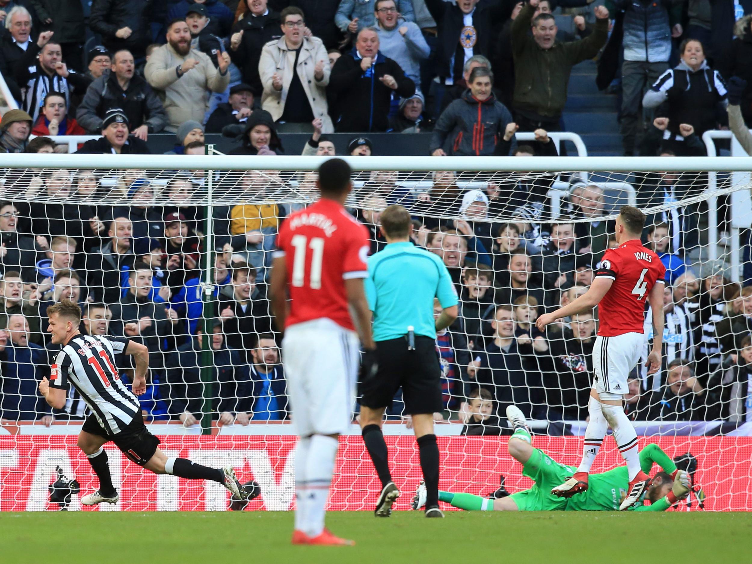 Matt Ritchie, left, spins away in celebration (Getty Images)