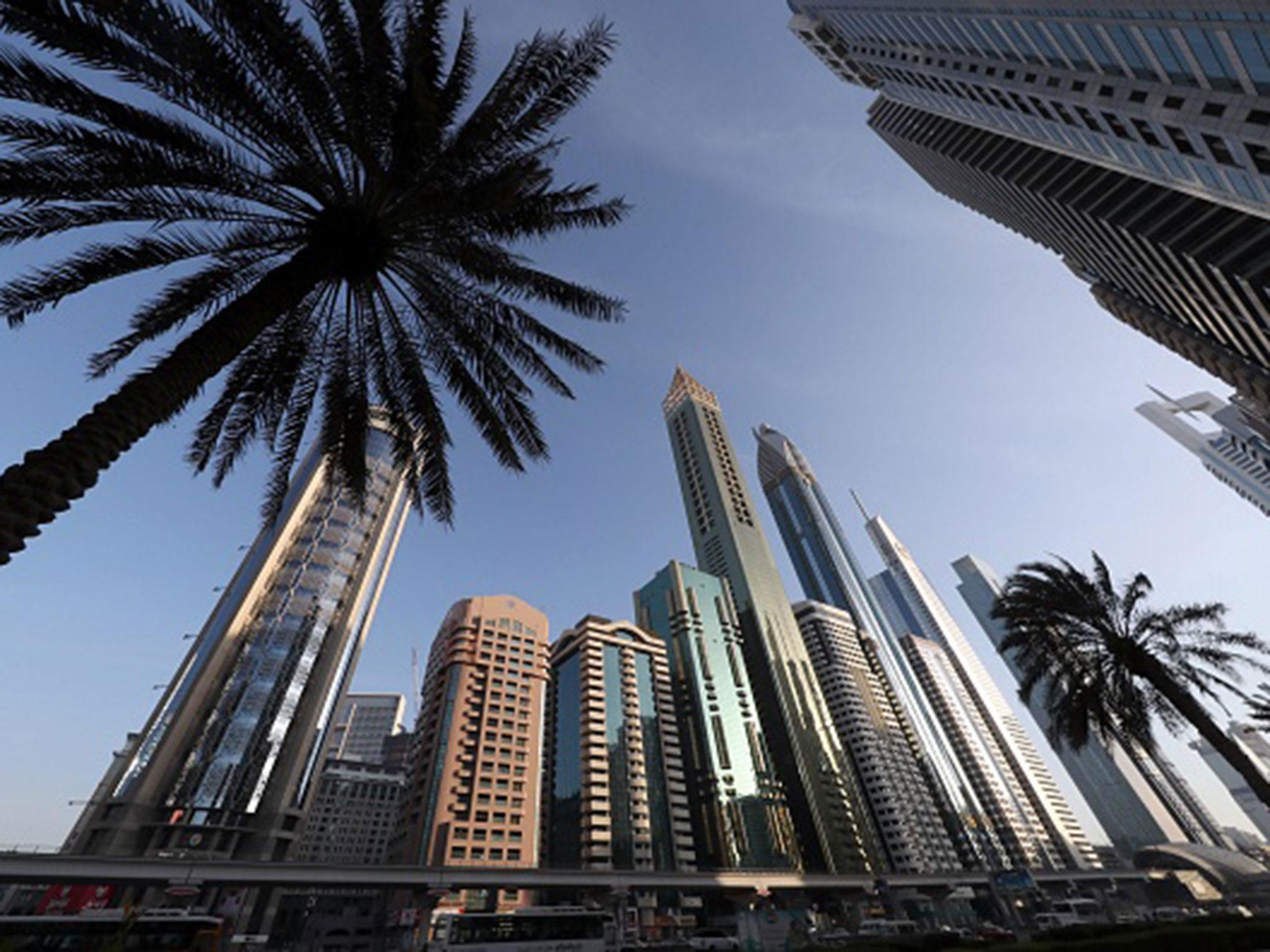 The 75-storey Gevora Hotel, the central gold tower with reflective cladding, which stands 356 metres or nearly a quarter of a mile tall (Getty Images )