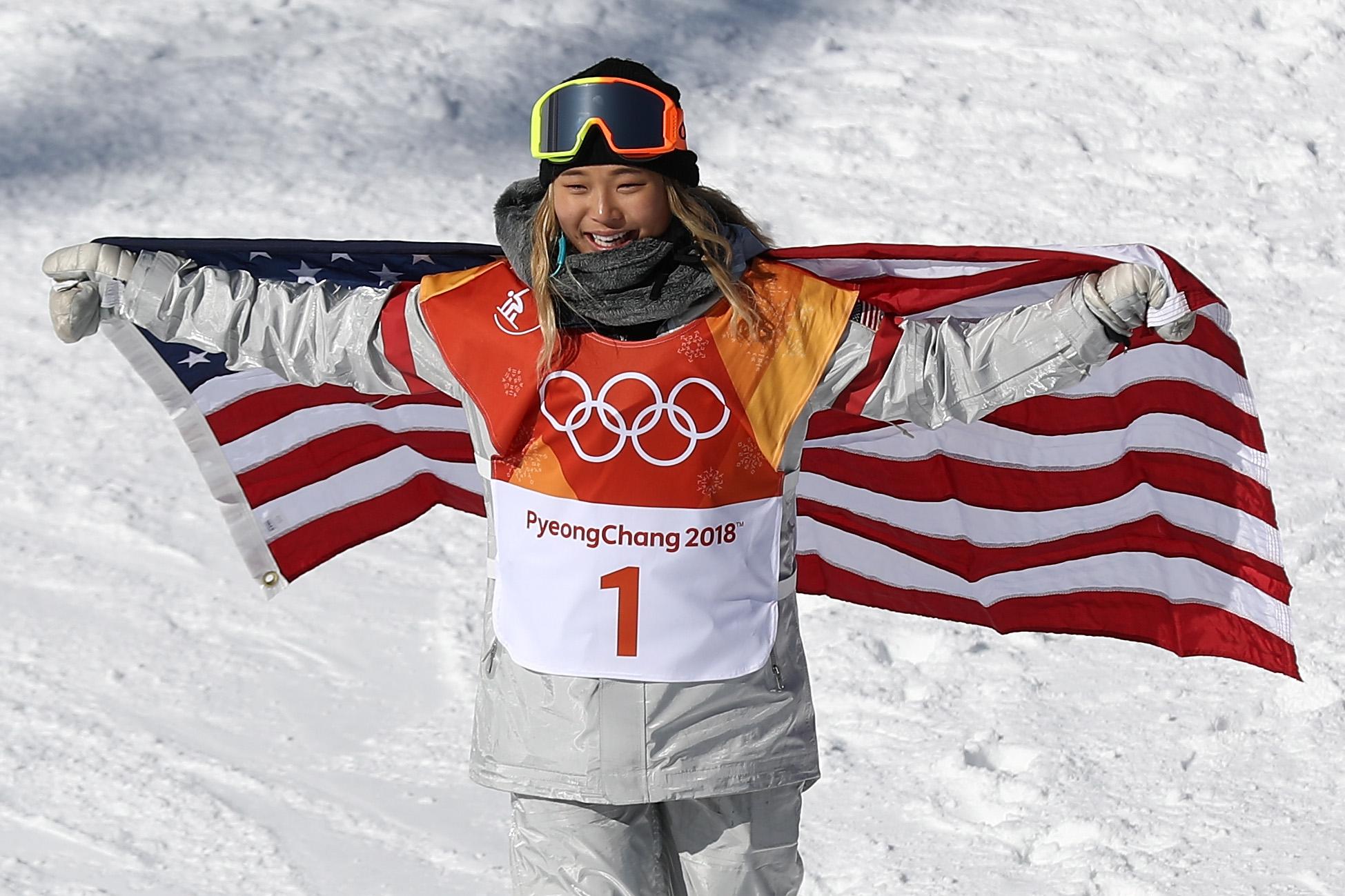 Gold medalist Chloe Kim celebrates winning the Snowboard Ladies' Halfpipe Final on day four of the PyeongChang 2018 Winter Olympic Games