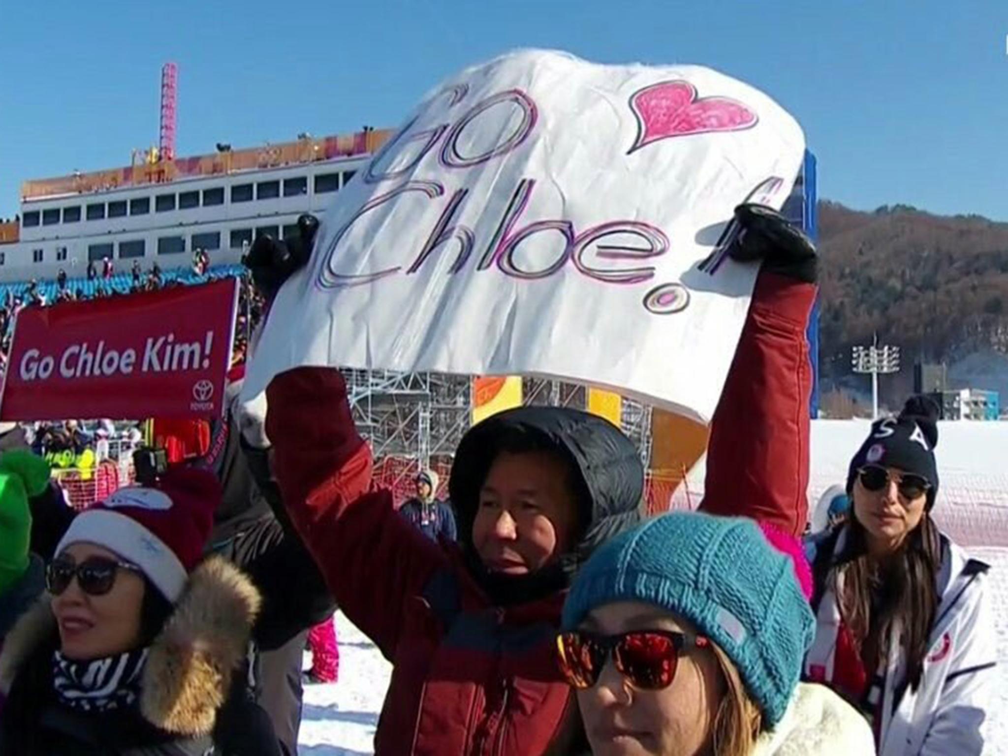 Jong Jin Kim cheers on his daughter Chloe in the Winter Olympics women's snowboard halfpipe final