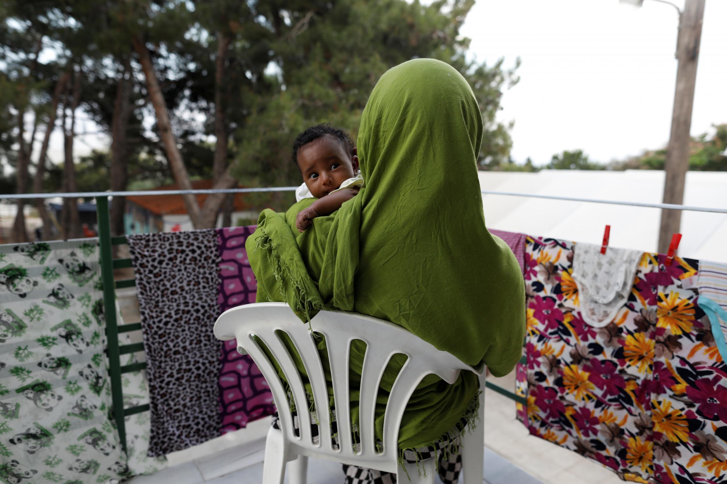 A refugee and her baby, who failed in efforts to join her husband in Austria