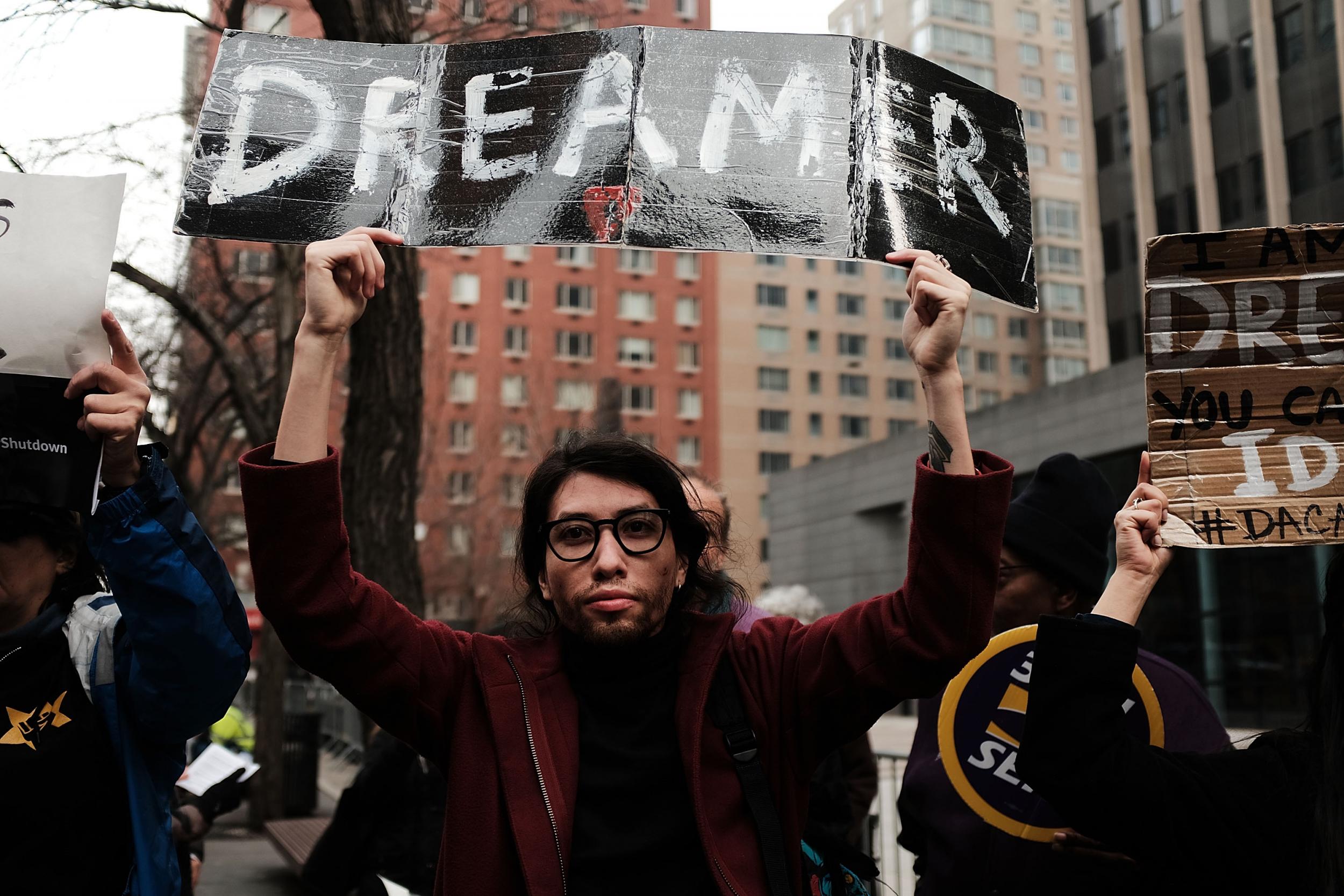 Demonstrators, many of them recent immigrants to America, protest the government shutdown and the lack of a deal on DACA