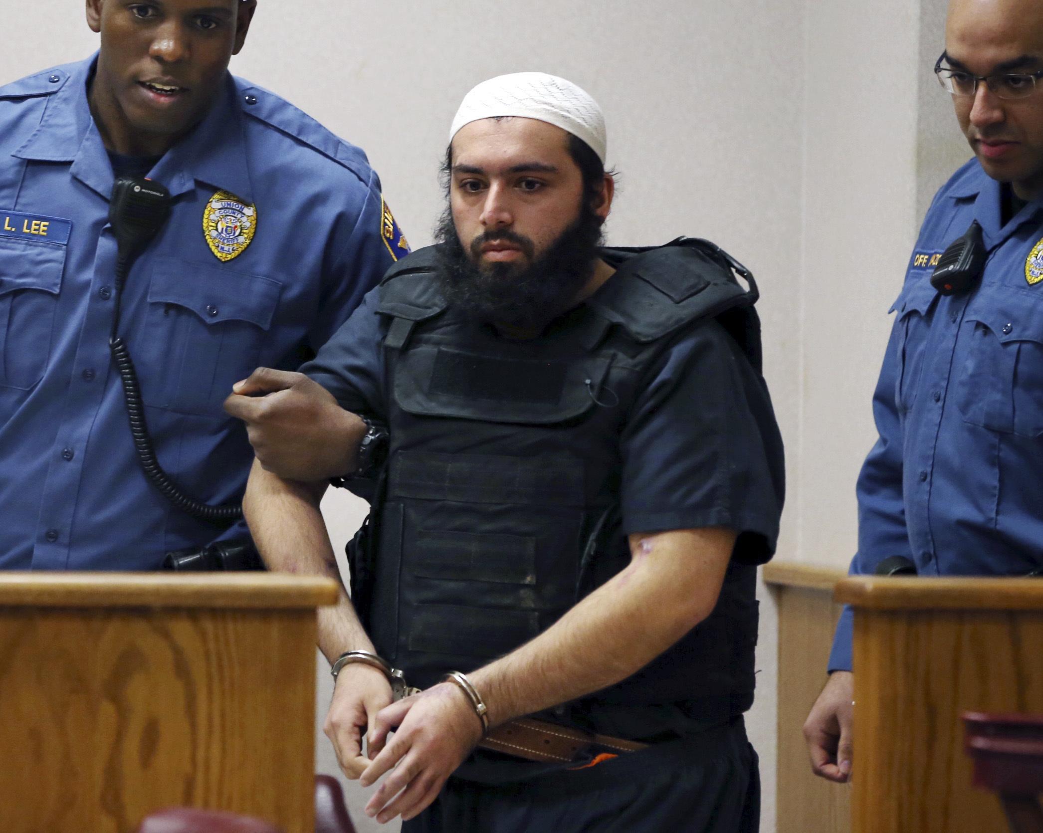 Ahmad Khan Rahami, center, is led into court in Elizabeth, New Jersey