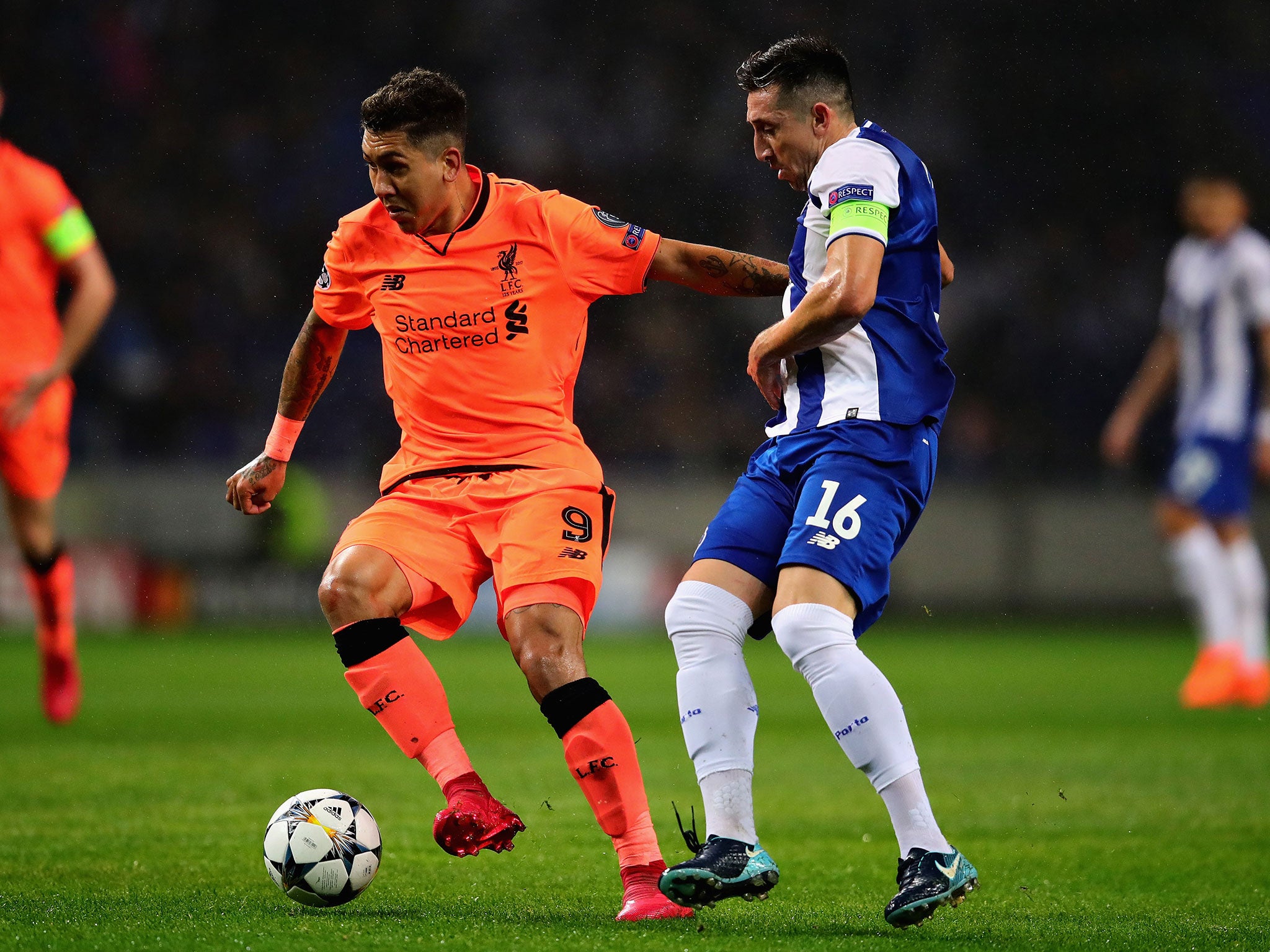 &#13;
Roberto Firmino attempts to get away from Hector Herrera &#13;