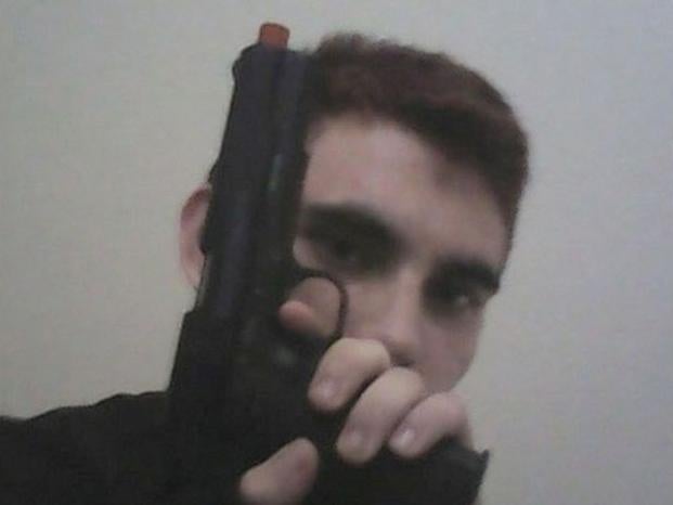 Nikolas Cruz posed with guns and posted about school shootings before the attack