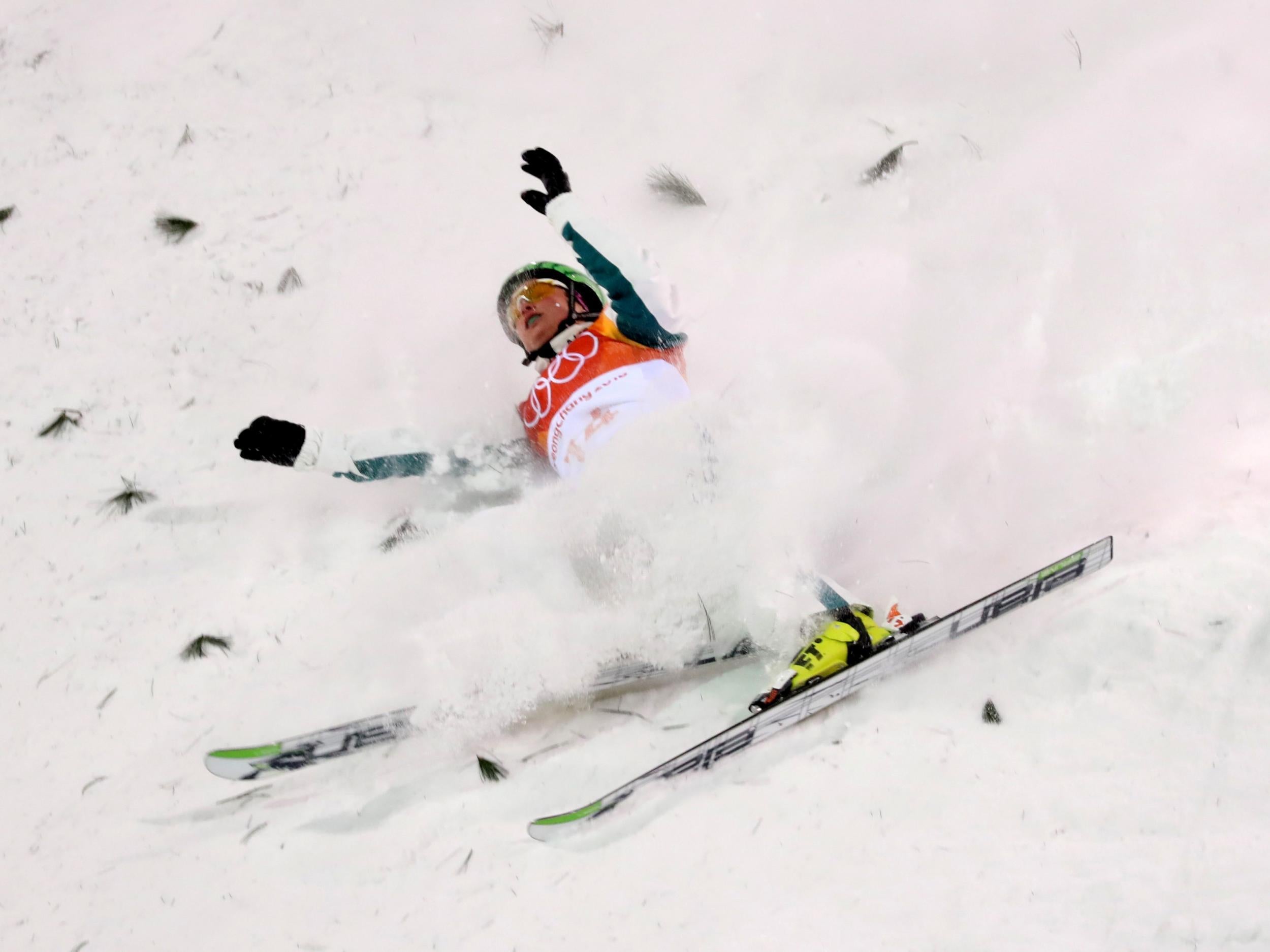 Samantha Wells of Australia falls off balance in the freestyle skiing