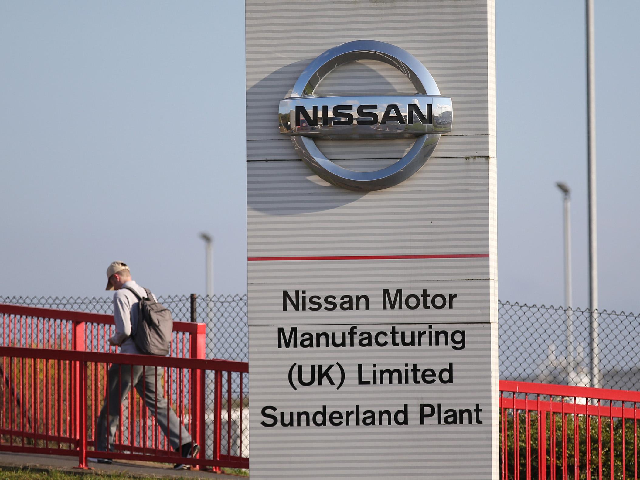 Workers leave the Nissan car plant after finishing their shift in Sunderland