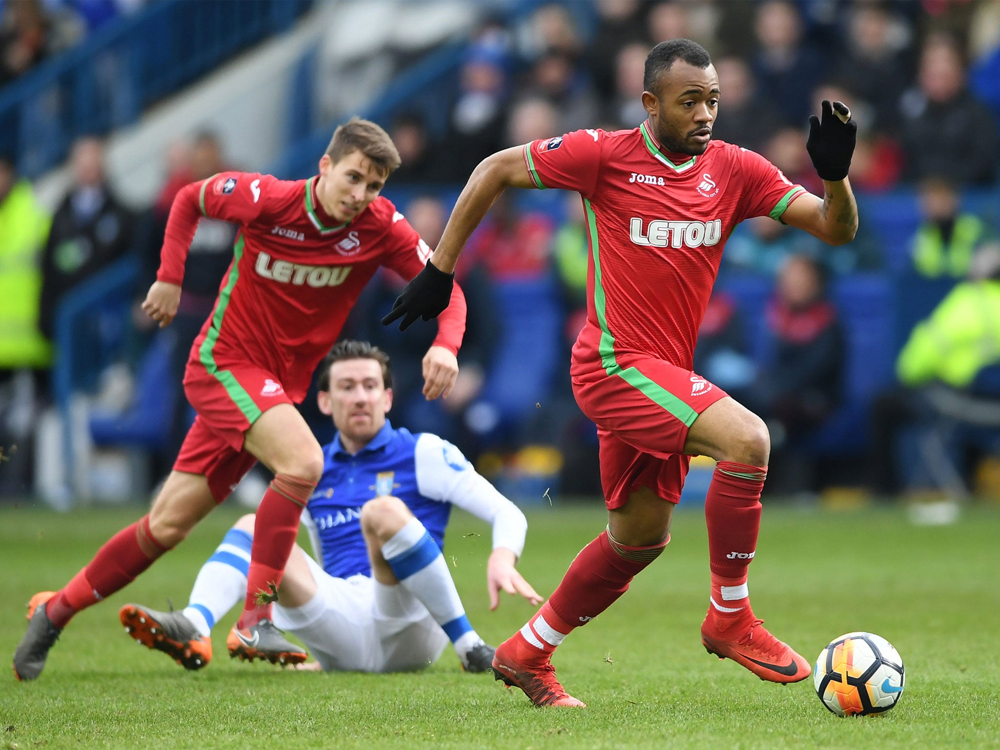 Jordan Ayew surges forward for the visitors