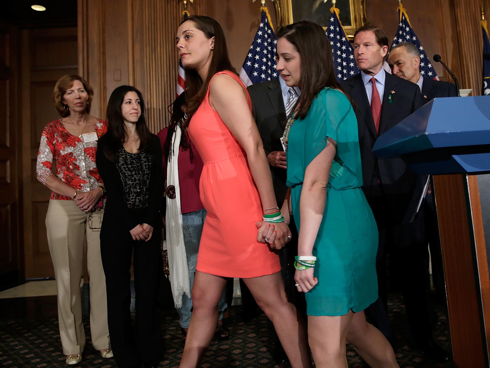 Prior to the first vote on gun reform in the US Senate, (l-r) Erica Lafferty and Jillian Soto leave the podium after joining with other families who have been victims of gun violence