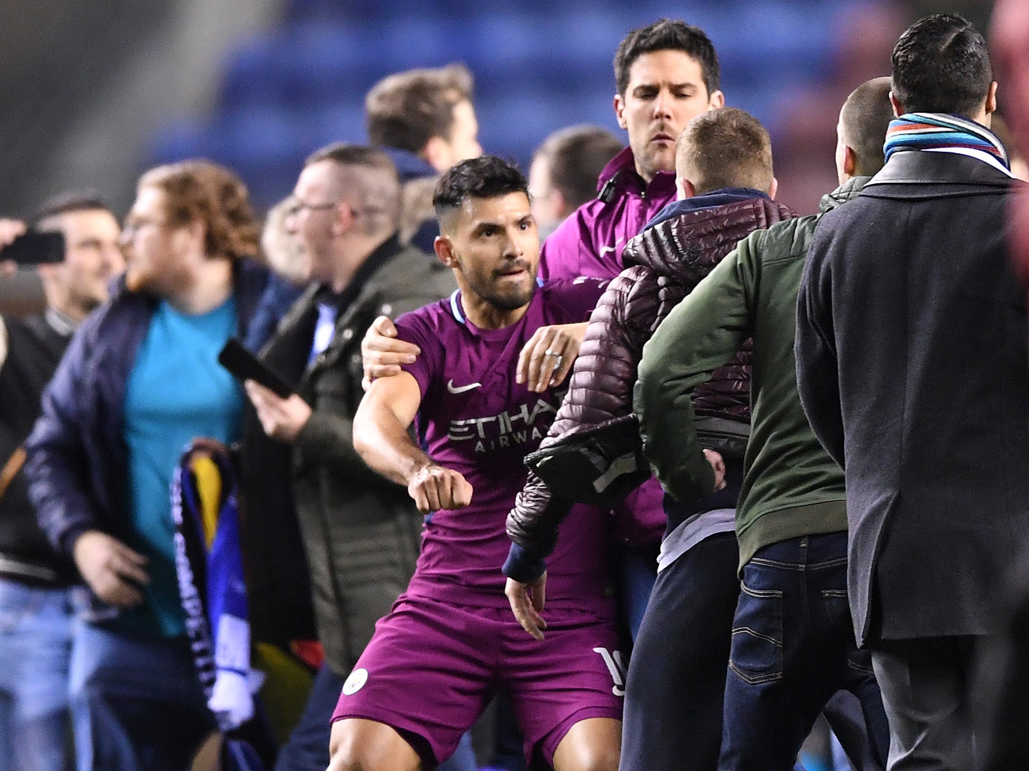 Aguero appeared to lash out at a Wigan supporter after being confronted