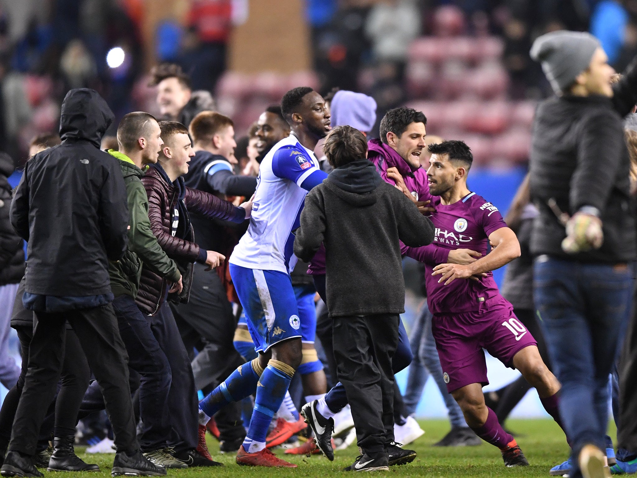 Aguero had to be retrained from reaching the fan