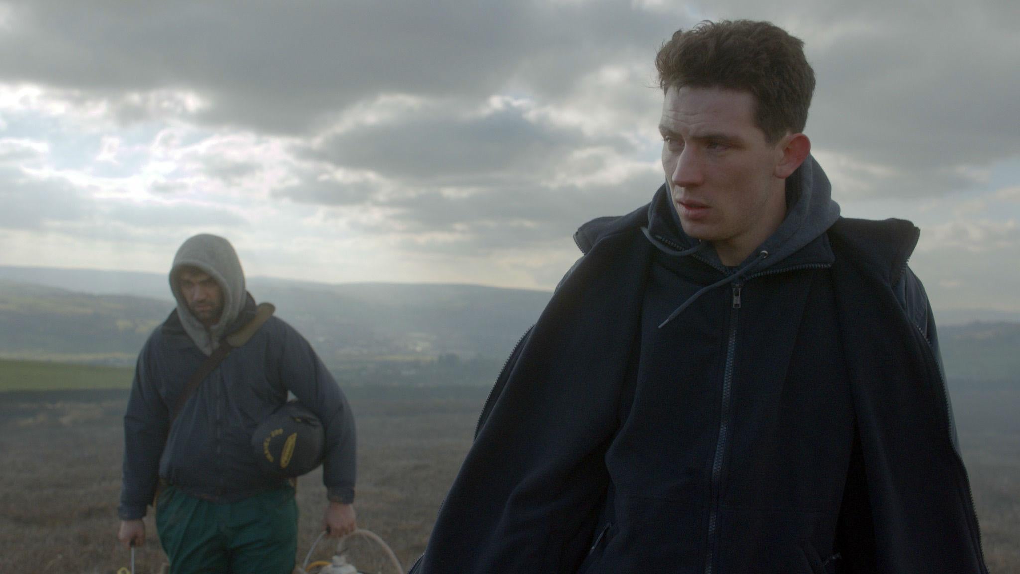 Josh O’Connor as John Saxby, a young farmer whose life is transformed by the arrival of a Romanian migrant worker