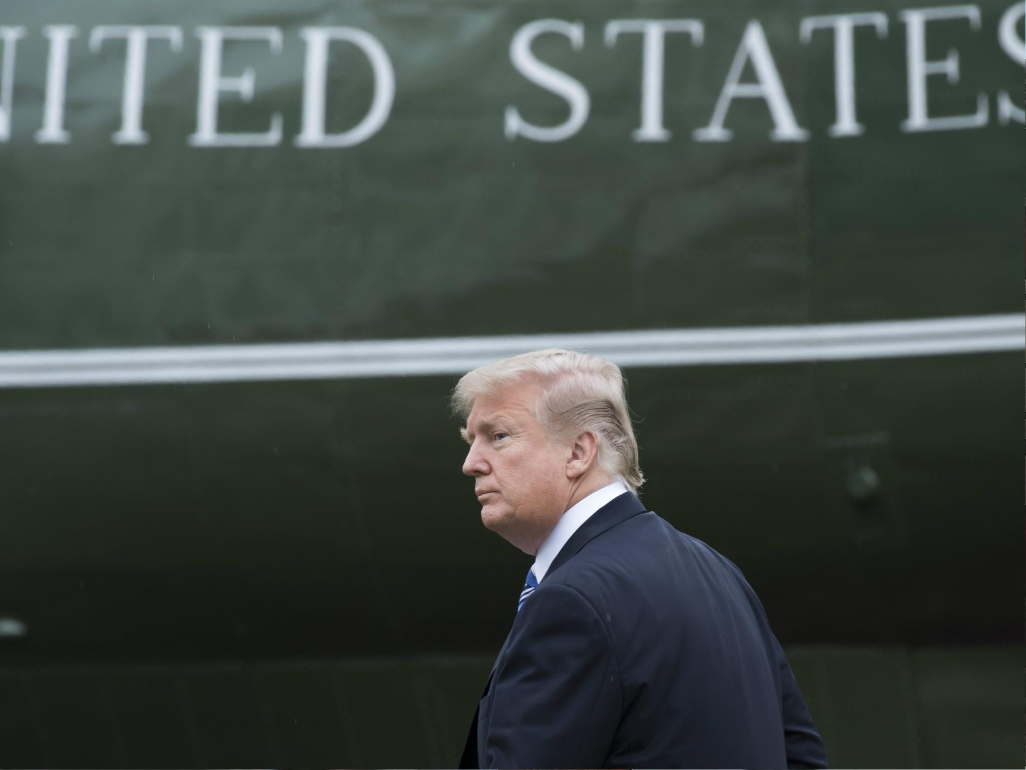 US President Donald Trump walks to Marine One prior to departure the White House on 16 February 2018