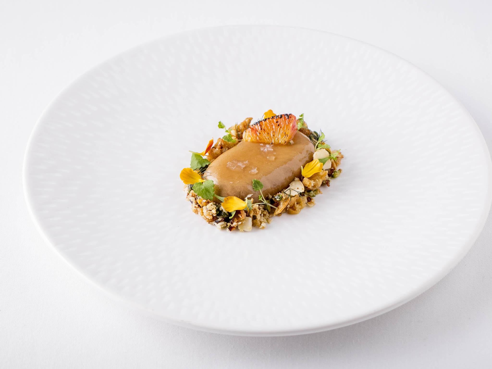 The highlight of the five courses is the parfait, featuring a blood orange glaze and crispy chicken skin granola