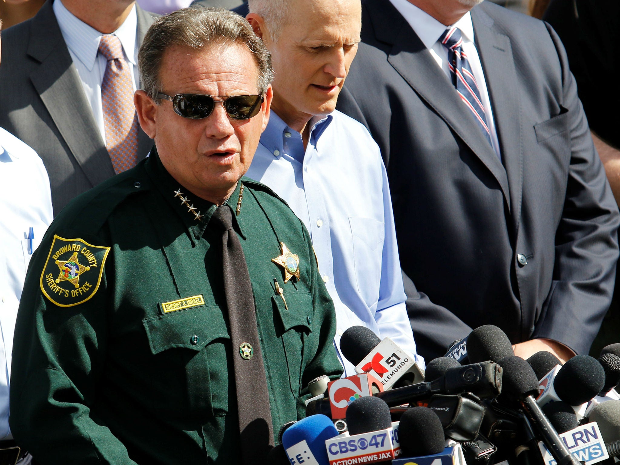 Mr Israel pictured here at a press conference following the shooting